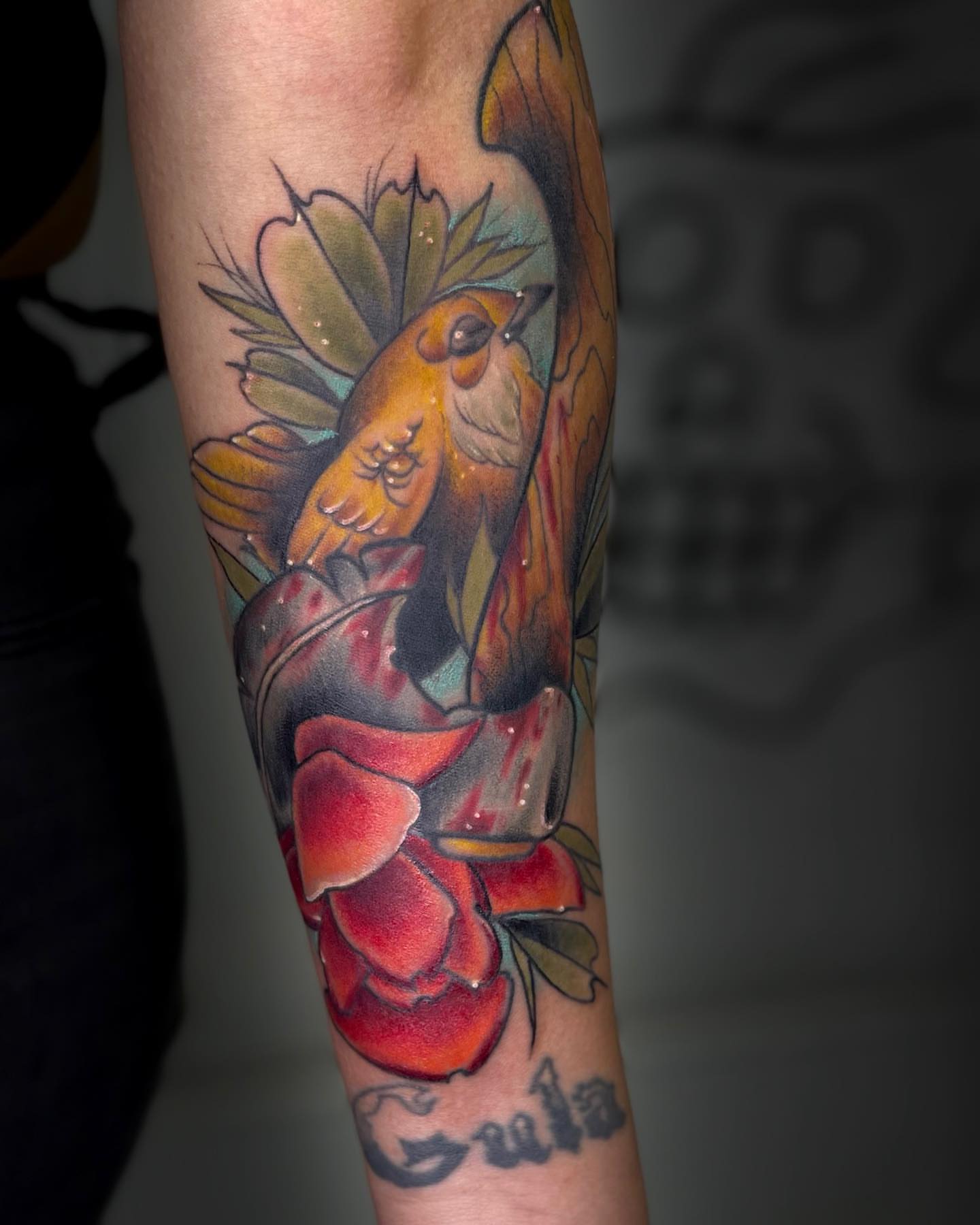Bird and rose American traditional tattoo on the forearm by E