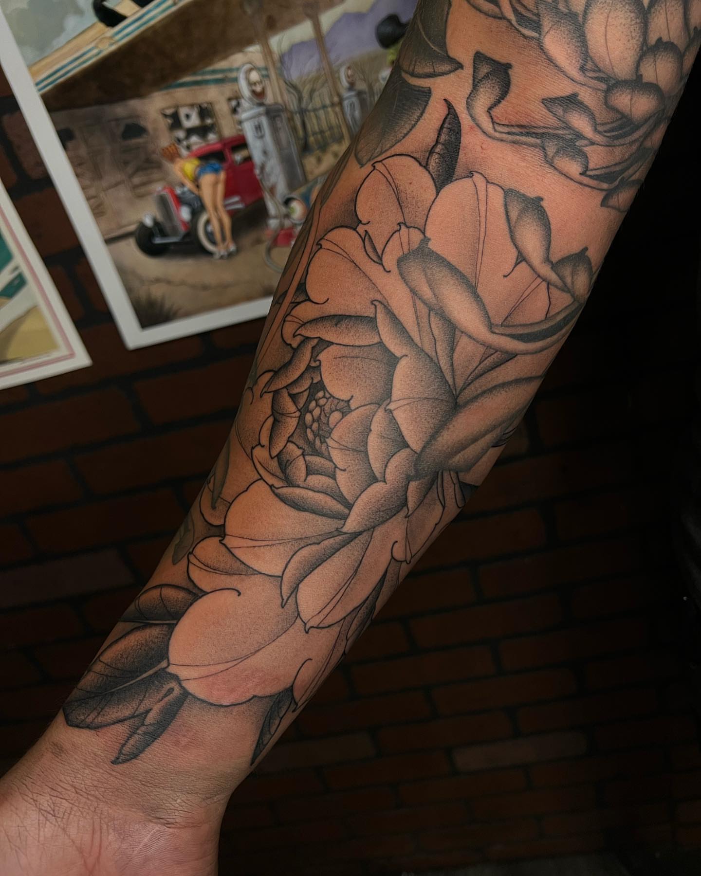 Peony black and grey tattoo on the forearm by Neo-Traditional tattoos in Las Vegas