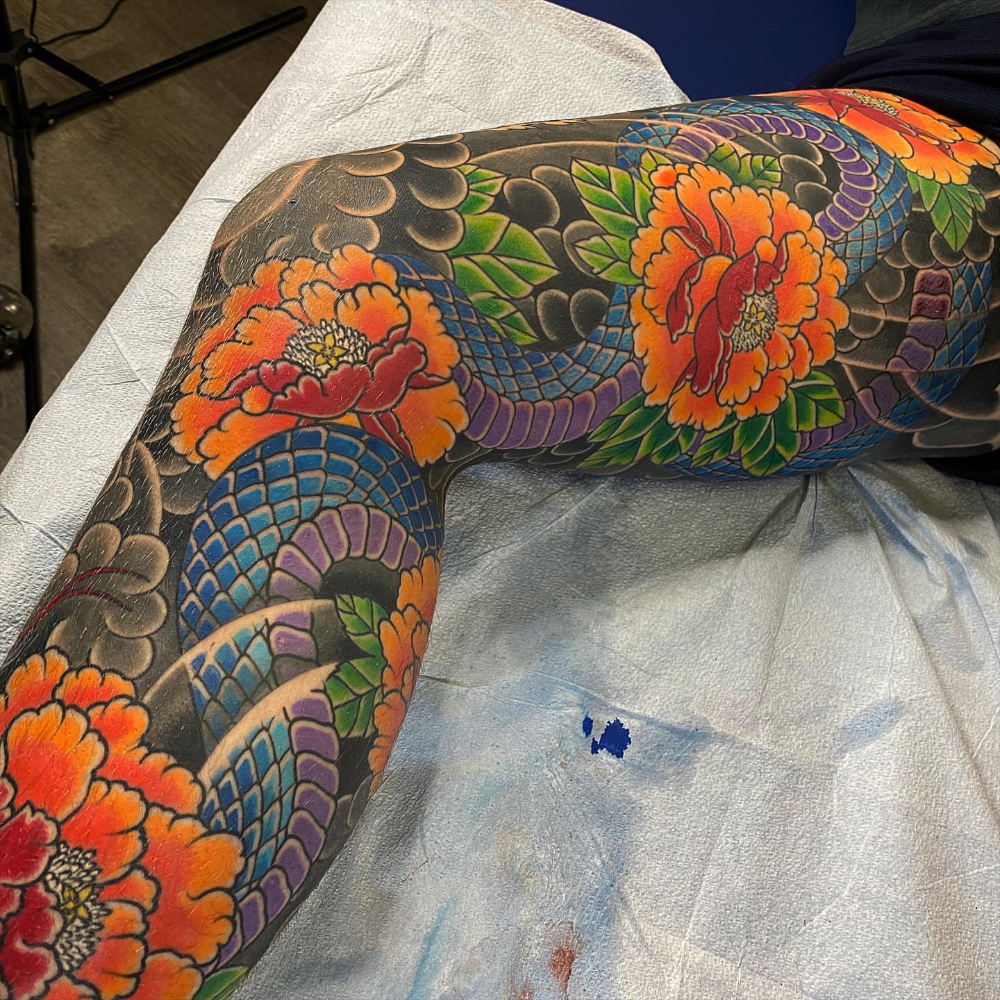 Snake and peony japanese irezumi tattoo on the thigh by Erick Lynch, Cambridge, Massachusetts