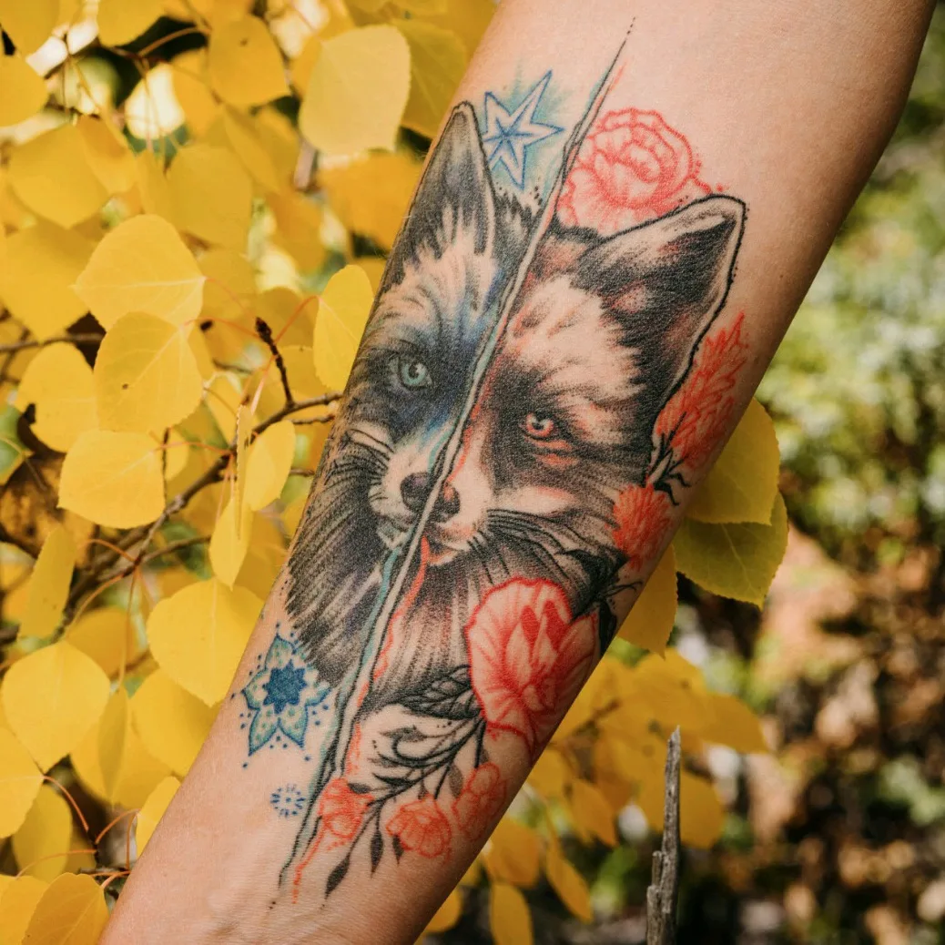 Fox and flowers realism tattoo on the forearm by Gail Howard Perry III