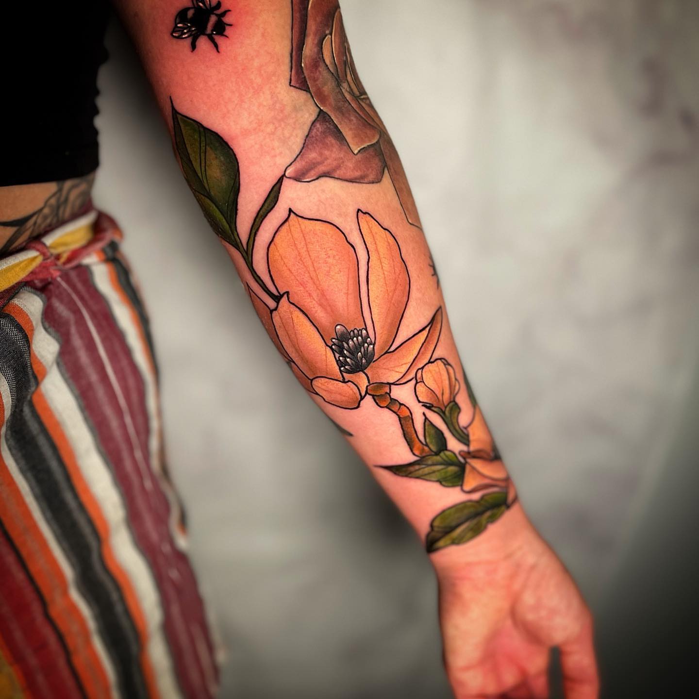 Magnolia flower realism tattoo on the forearm by 𝓚𝓪𝓼𝓼𝓪𝓷𝓭𝓻𝓪 𝓜𝓬𝓒𝓪𝓵𝓵, Eugene, Oregon