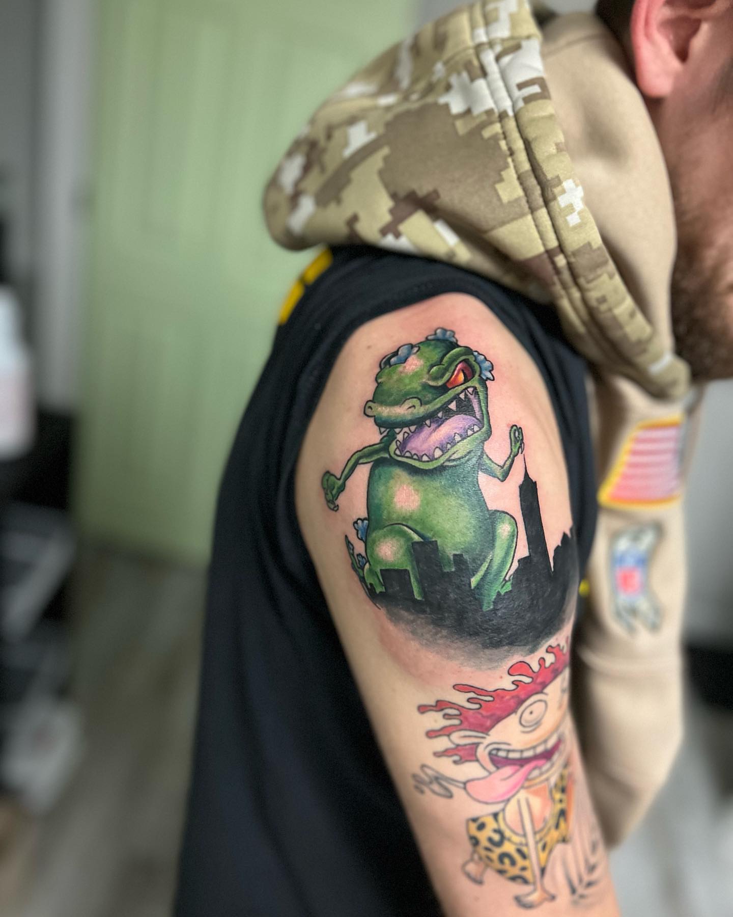 Green monster new school tattoo on the upper arm by Luis Cabrera, Cleveland, Ohio