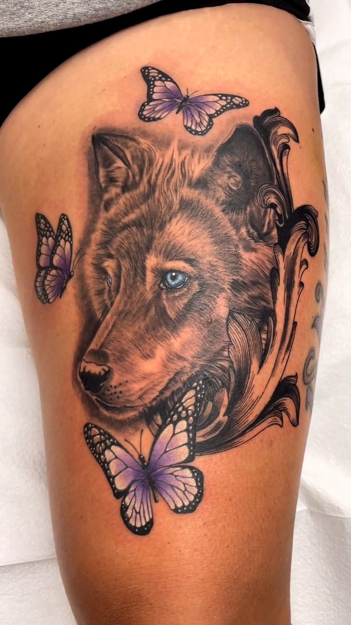 Wolf and butterflies realism tattoo by Charlie