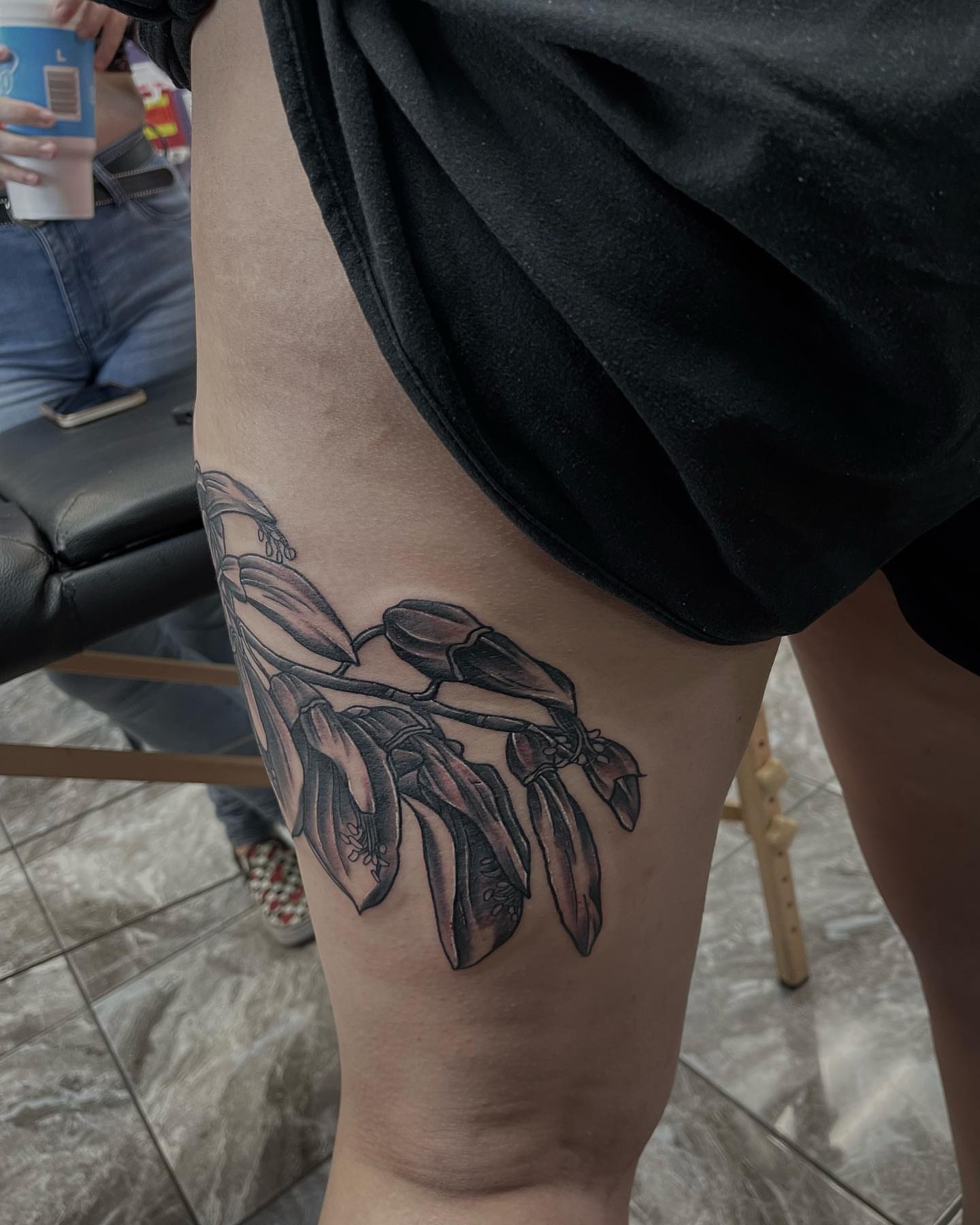Banana plant black and grey tattoo on the thigh by Billy Harris