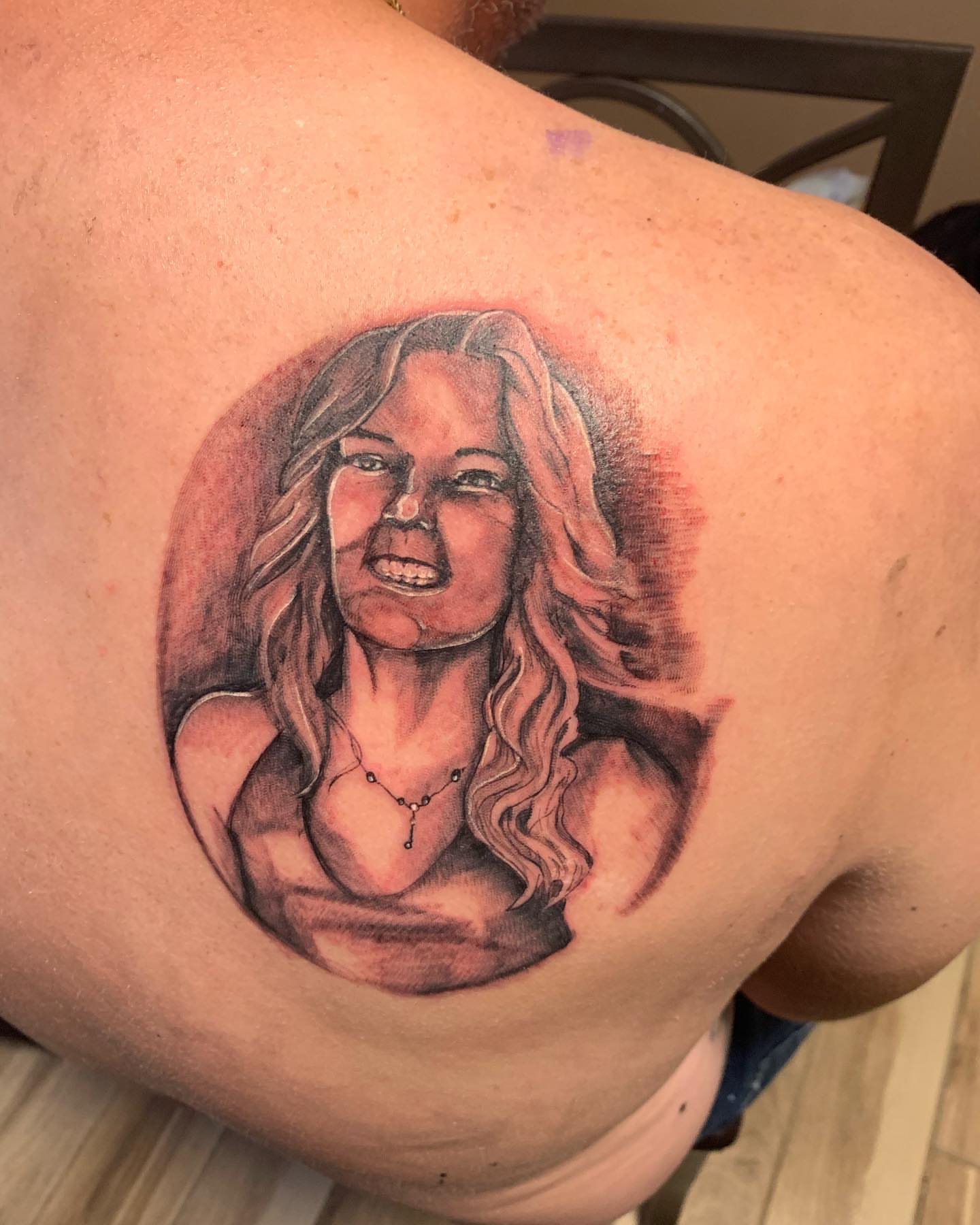 Portrait realism tattoo on the shoulder by Daniel Illachek