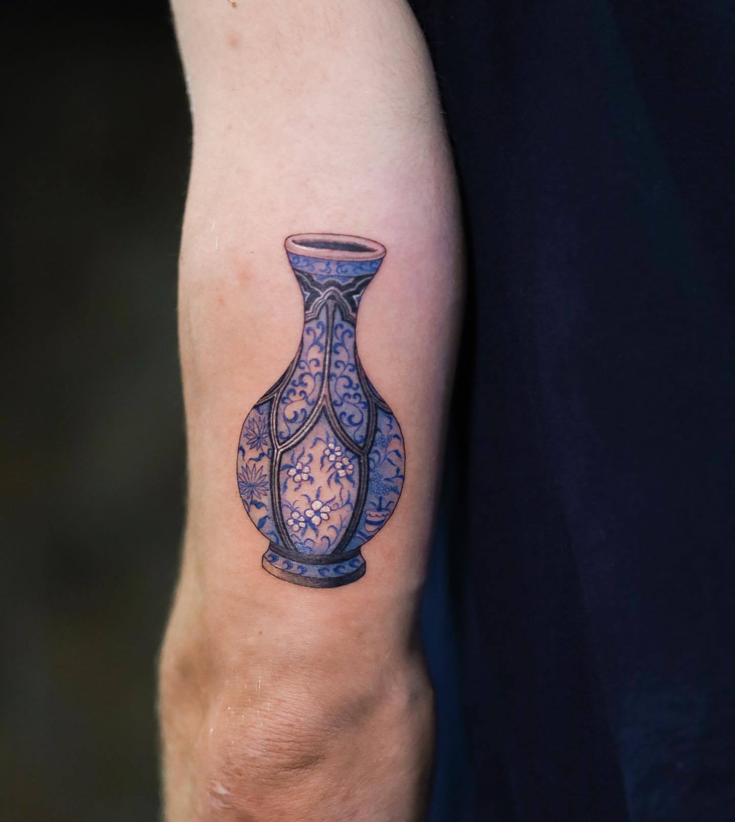 Blue and white vase ornamental tattoo on the forearm by Swani