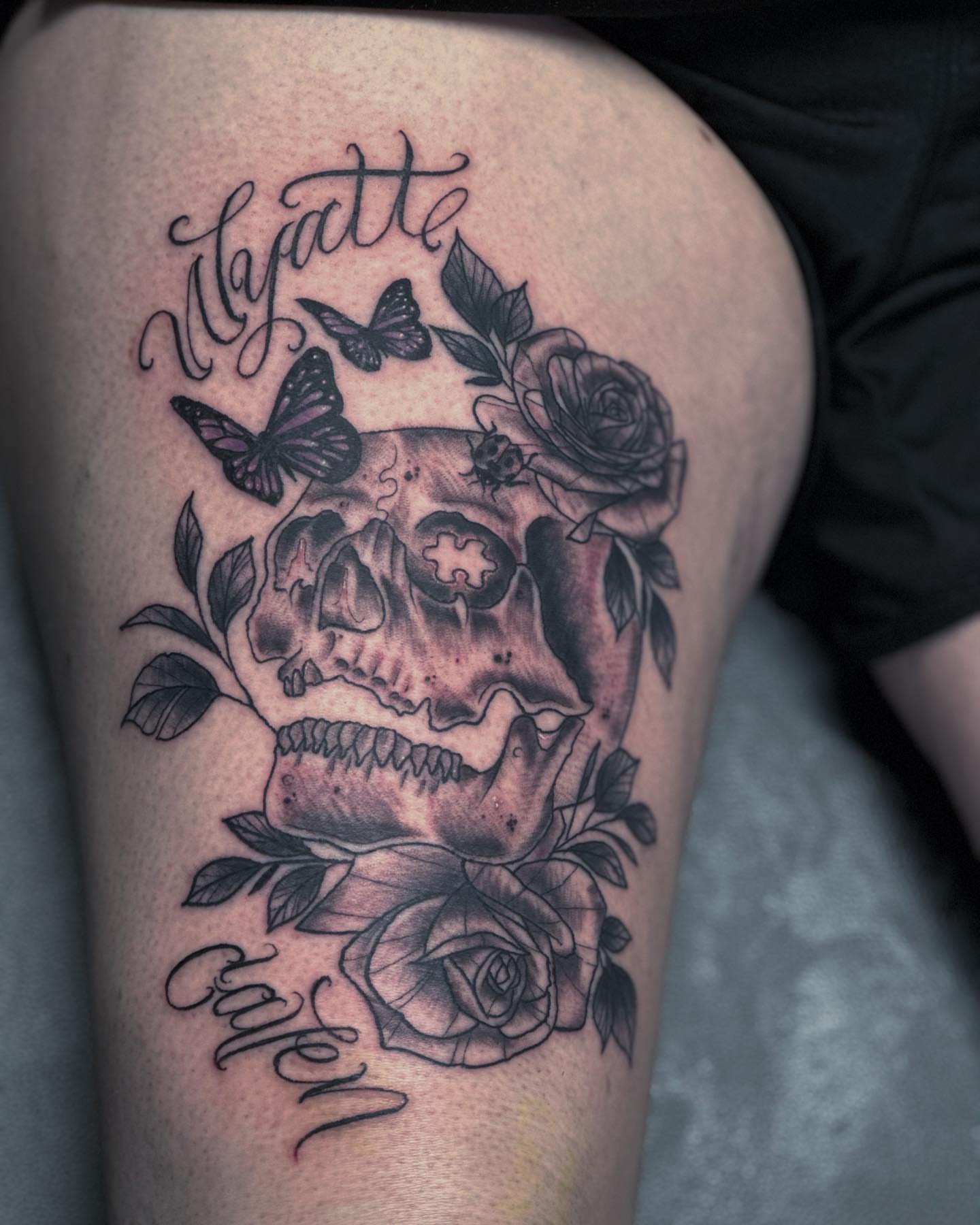 Skull with roses realism tattoo on the thigh by duffs, San Marcos, California