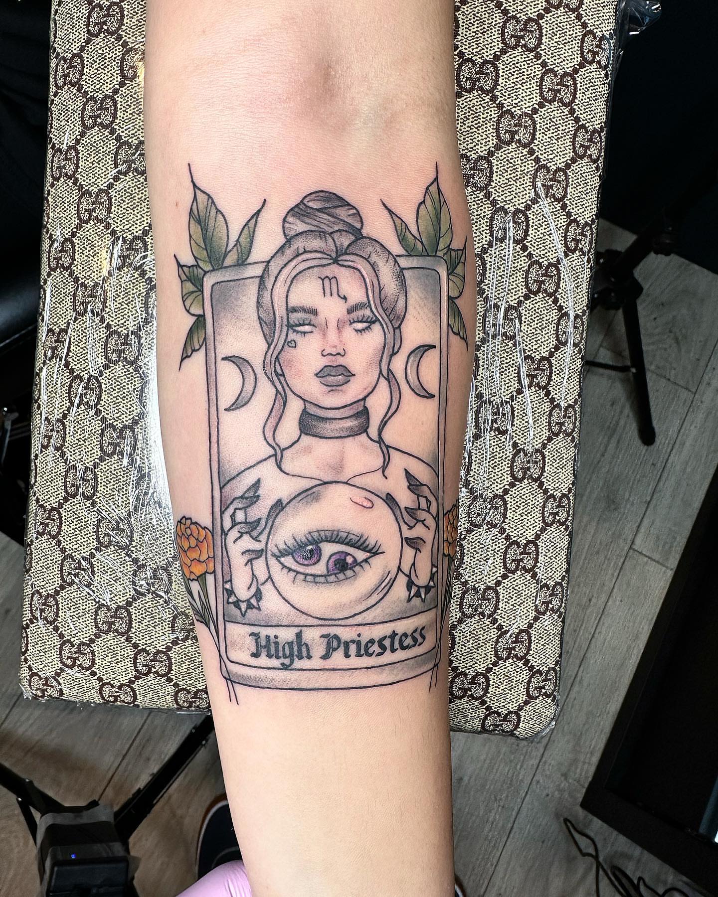 High Priestess tarot card black and grey tattoo on the forearm by Diana Kunz
