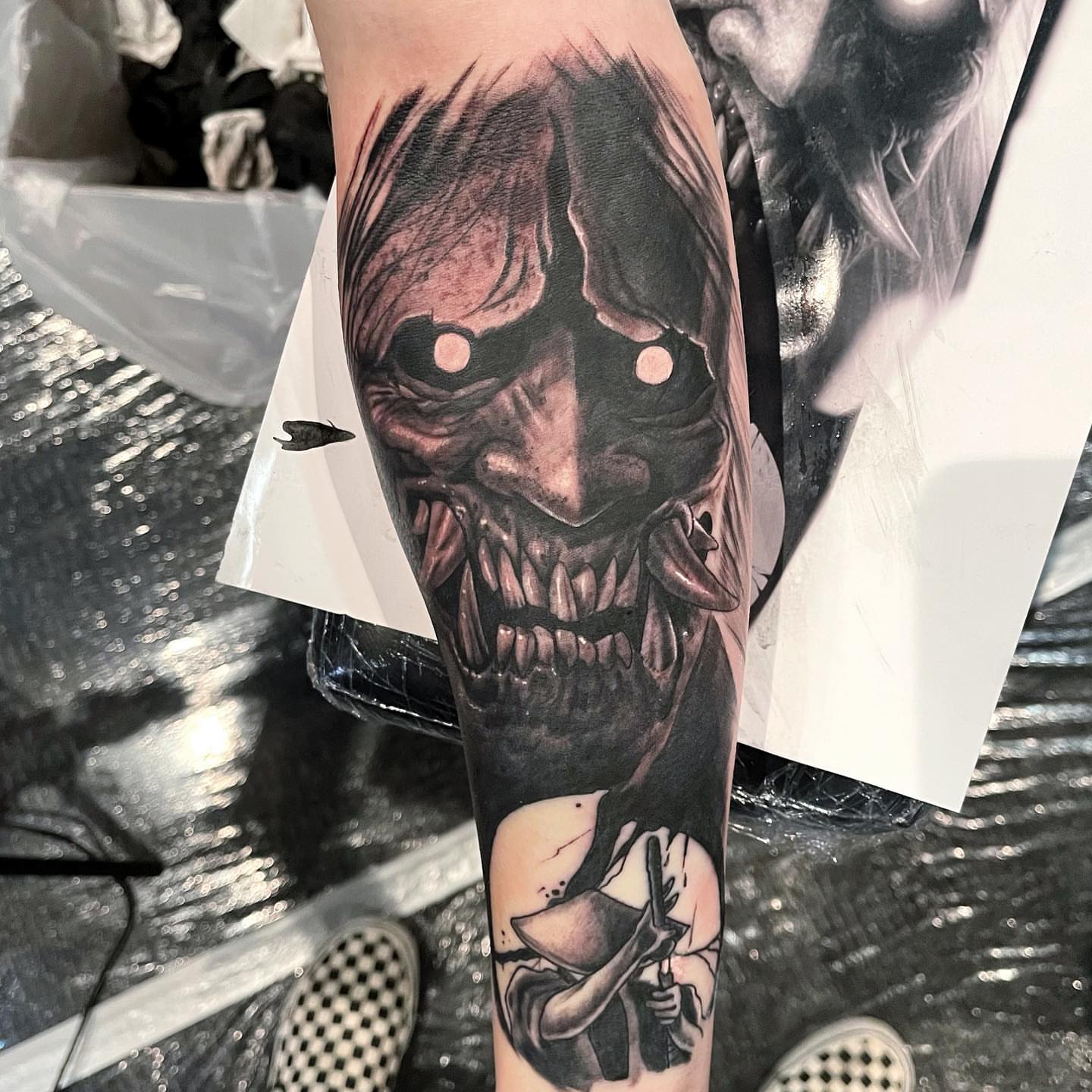 Demon face dark realism tattoo on the forearm by Antonio Massimino