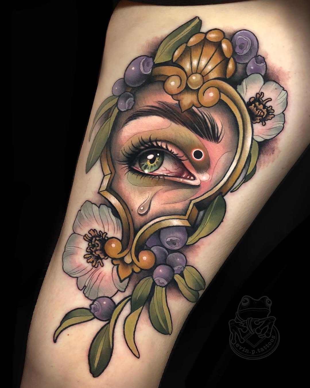 Eye with ornate frame and berries American traditional tattoo on the forearm by Evin Pfaff, Bedford, Pennsylvania