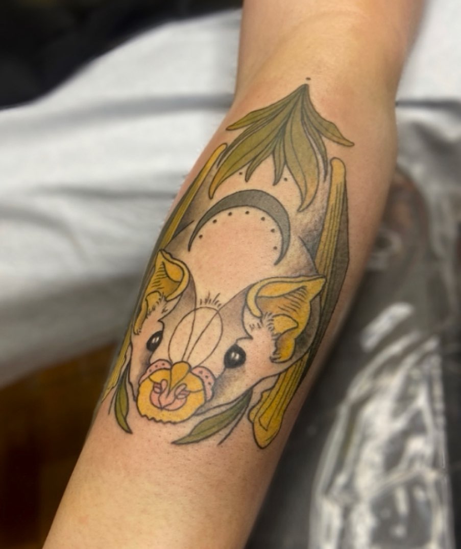 Bat and orchid American traditional tattoo on the forearm by Alicia