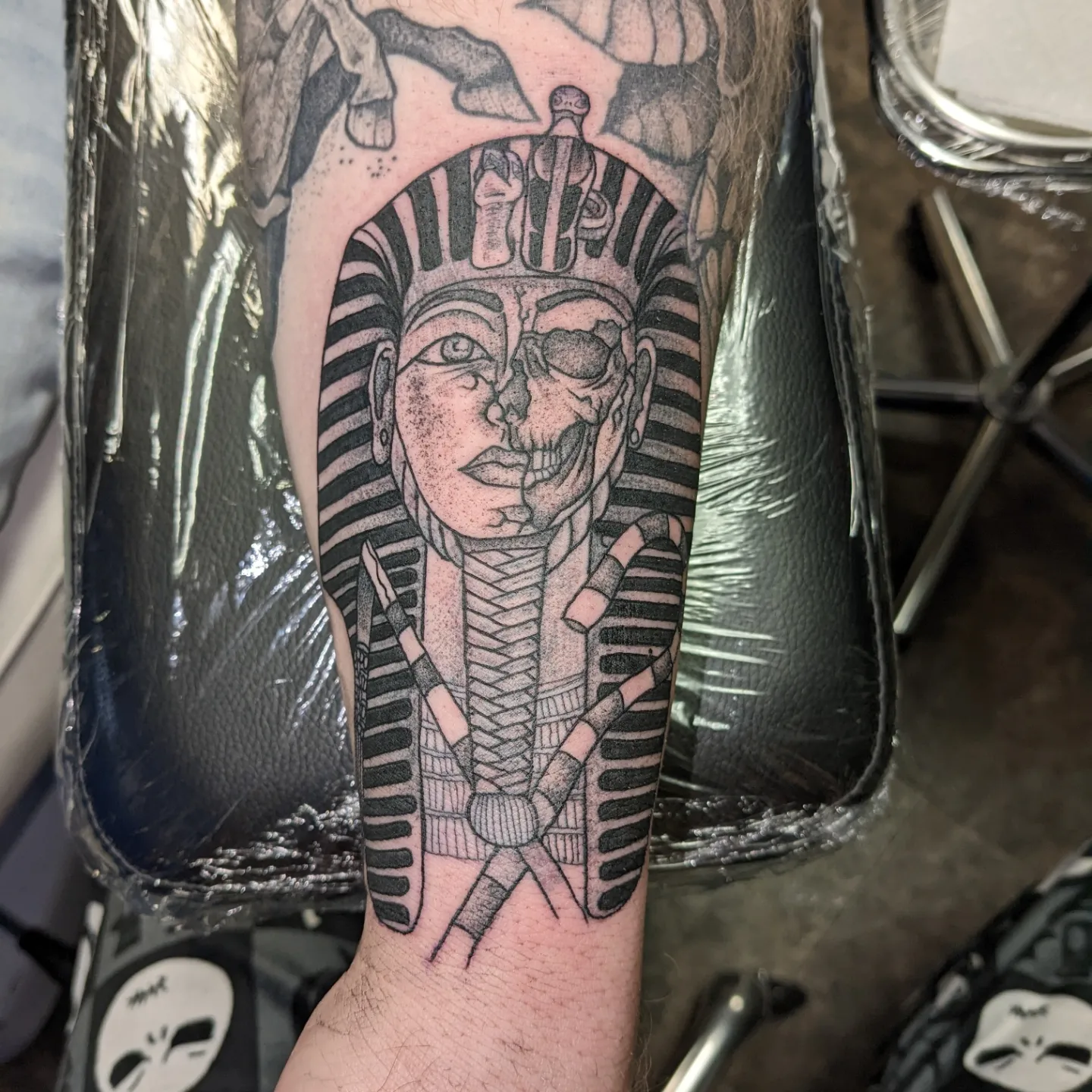 Pharaoh black and grey tattoo on the forearm by Kara Falcon