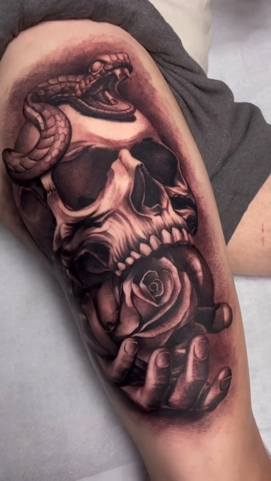 Skull with snake and roses dark realism tattoo by Ryan Jenkins, Las Vegas, Nevada