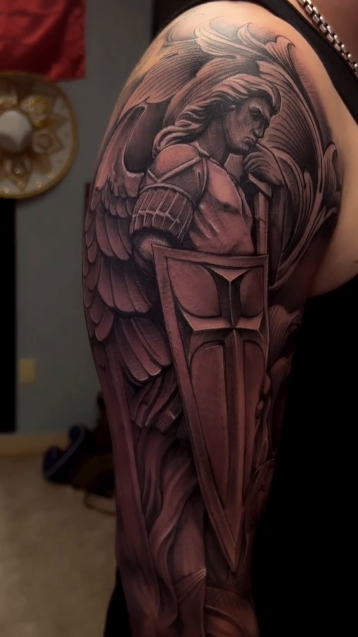 Angel with shield realism tattoo by @young_sely