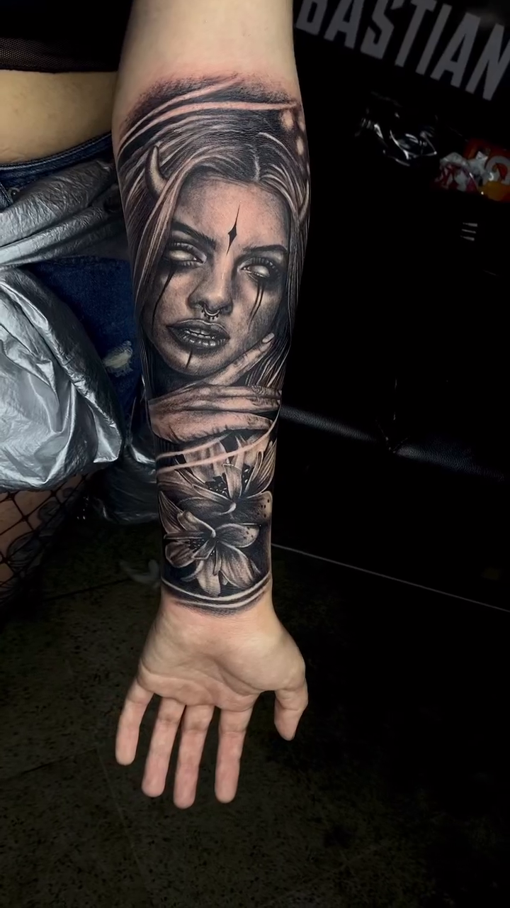 Woman's portrait with floral elements realism tattoo by Ricardo javier Gil, Dallas, Texas