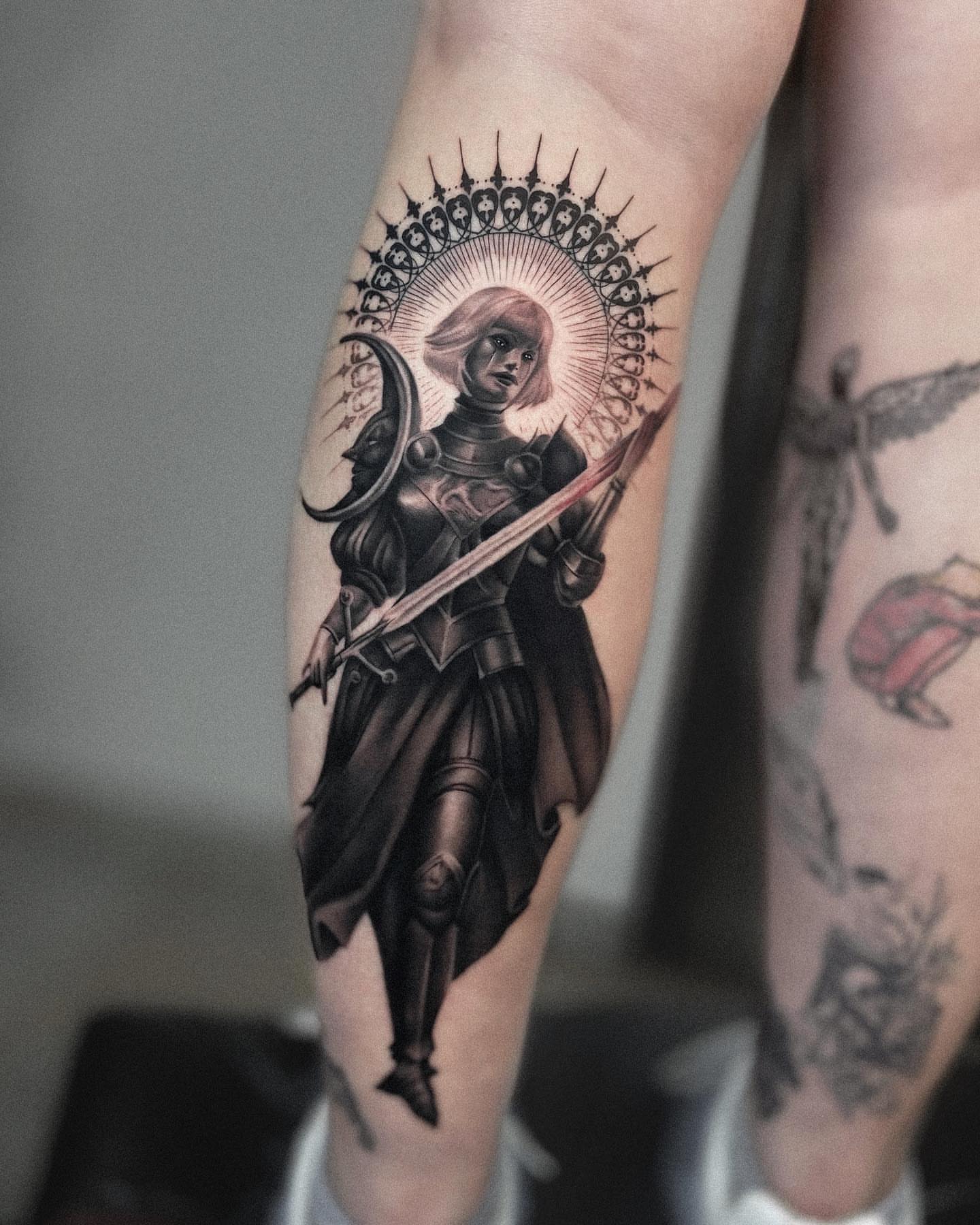 Female knight realism tattoo on the forearm by Oleksandr Moroz