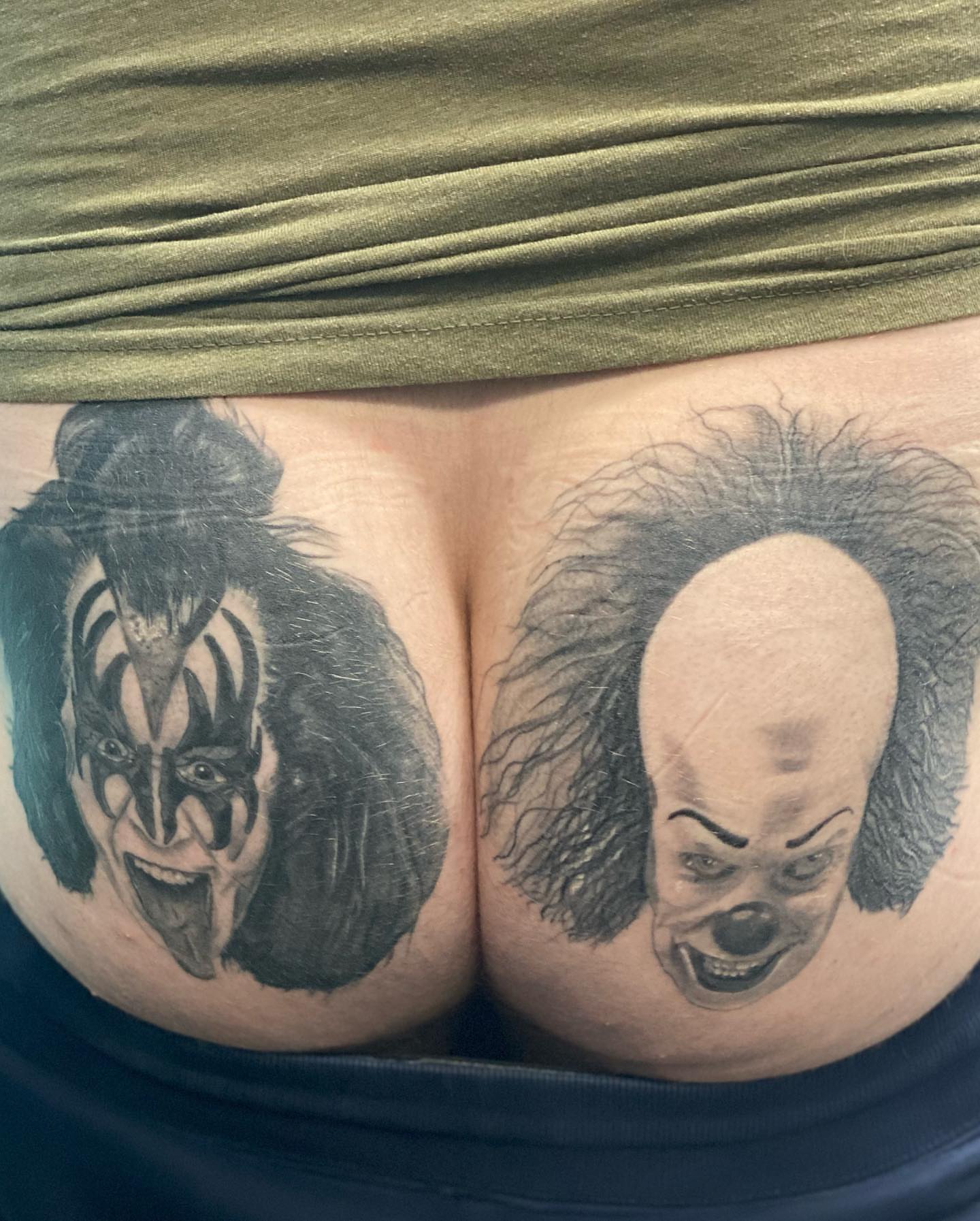 Clowns black and grey tattoo on the thigh by Alberto Ramirez