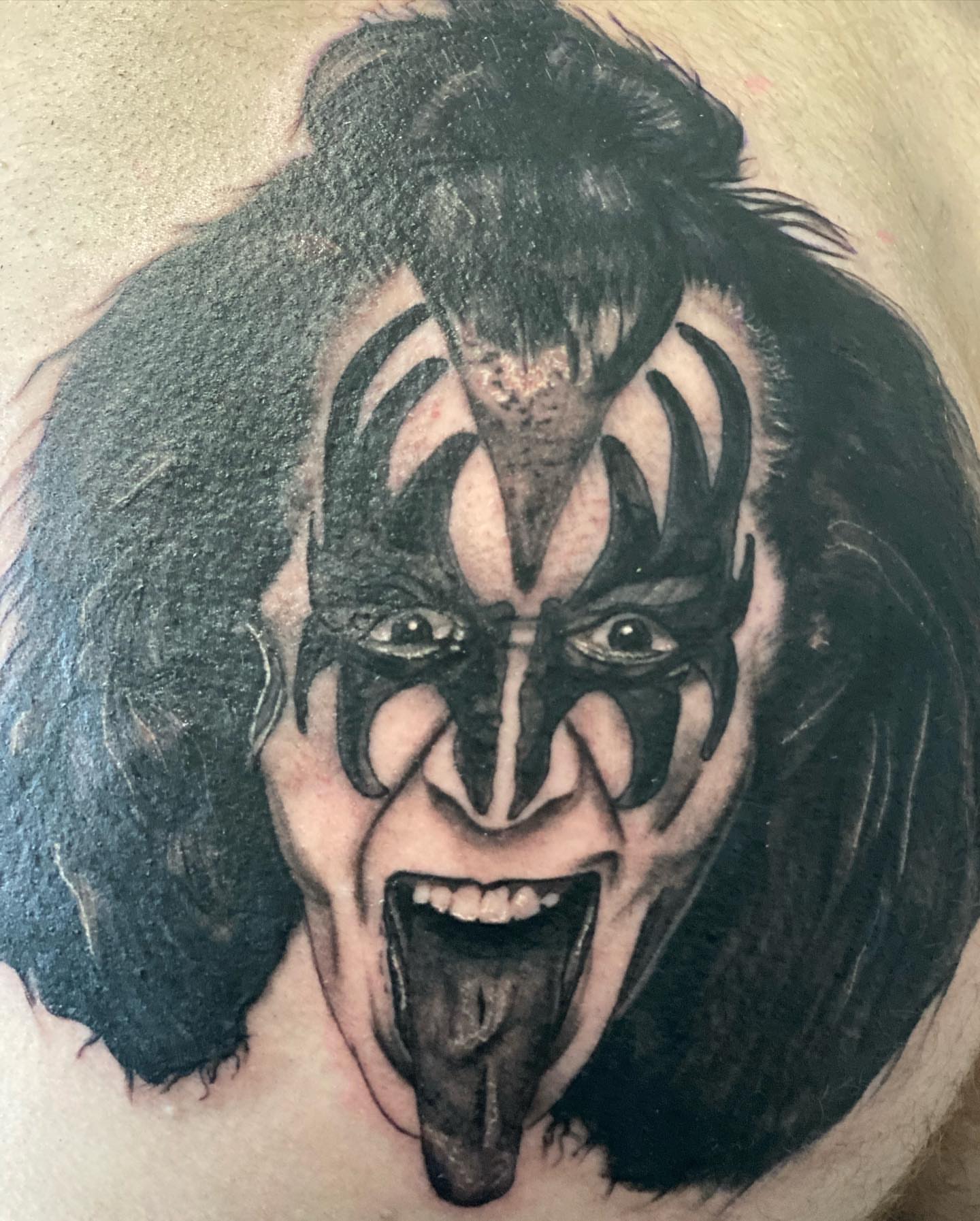 KISS band member black and grey tattoo on the chest by Alberto Ramirez