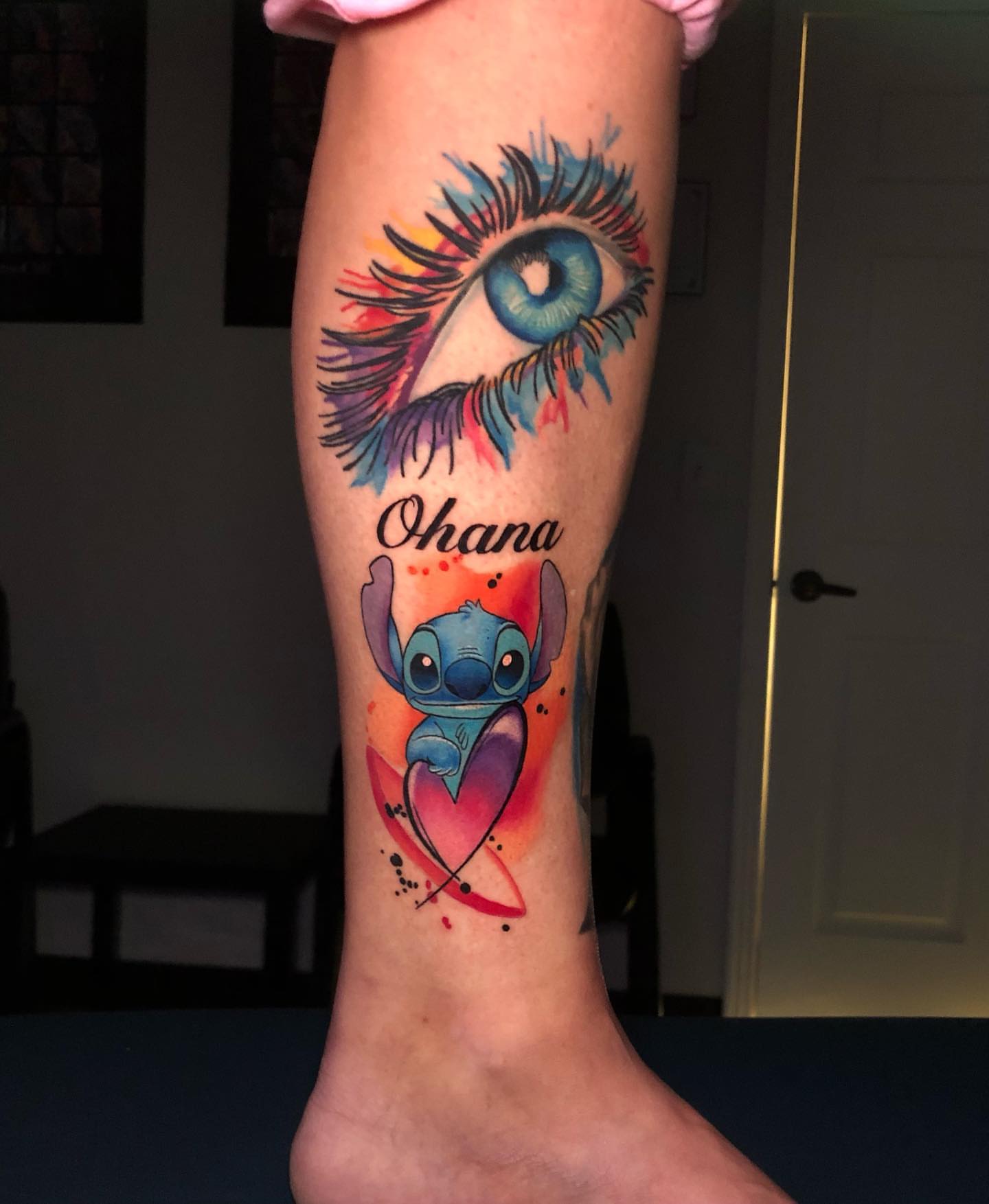 Stitch and Ohana watercolor tattoo on the forearm by Tiffany Bauer