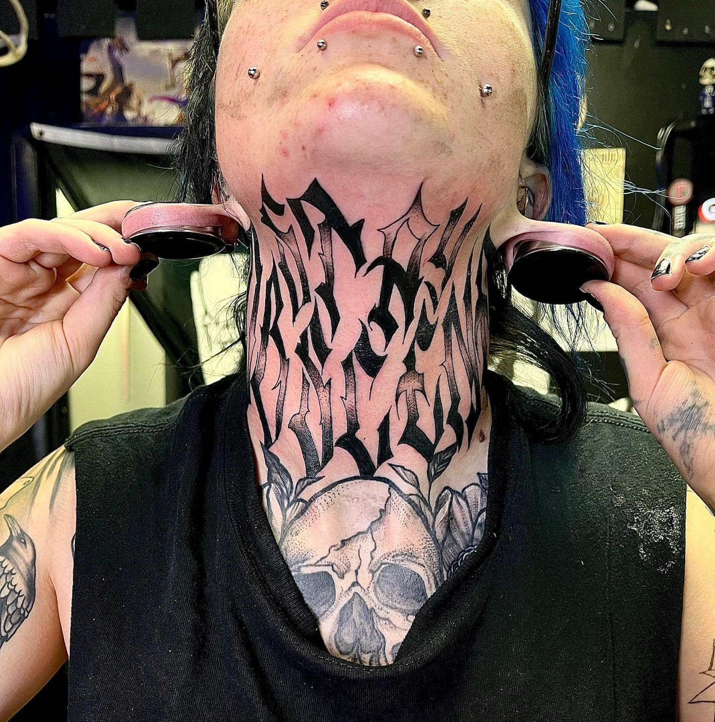 Skull and calligraphy black and grey tattoo on the neck by Colby McClain