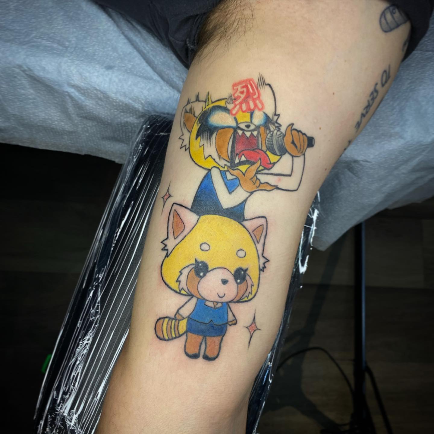 Anime characters anime tattoo on the forearm by Tj Silverhand