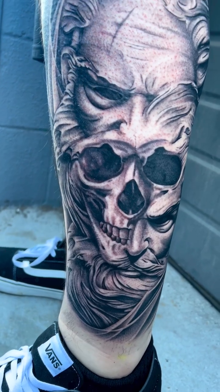 Skull and demonic face dark realism tattoo by Kyle Lopez, Union City, California