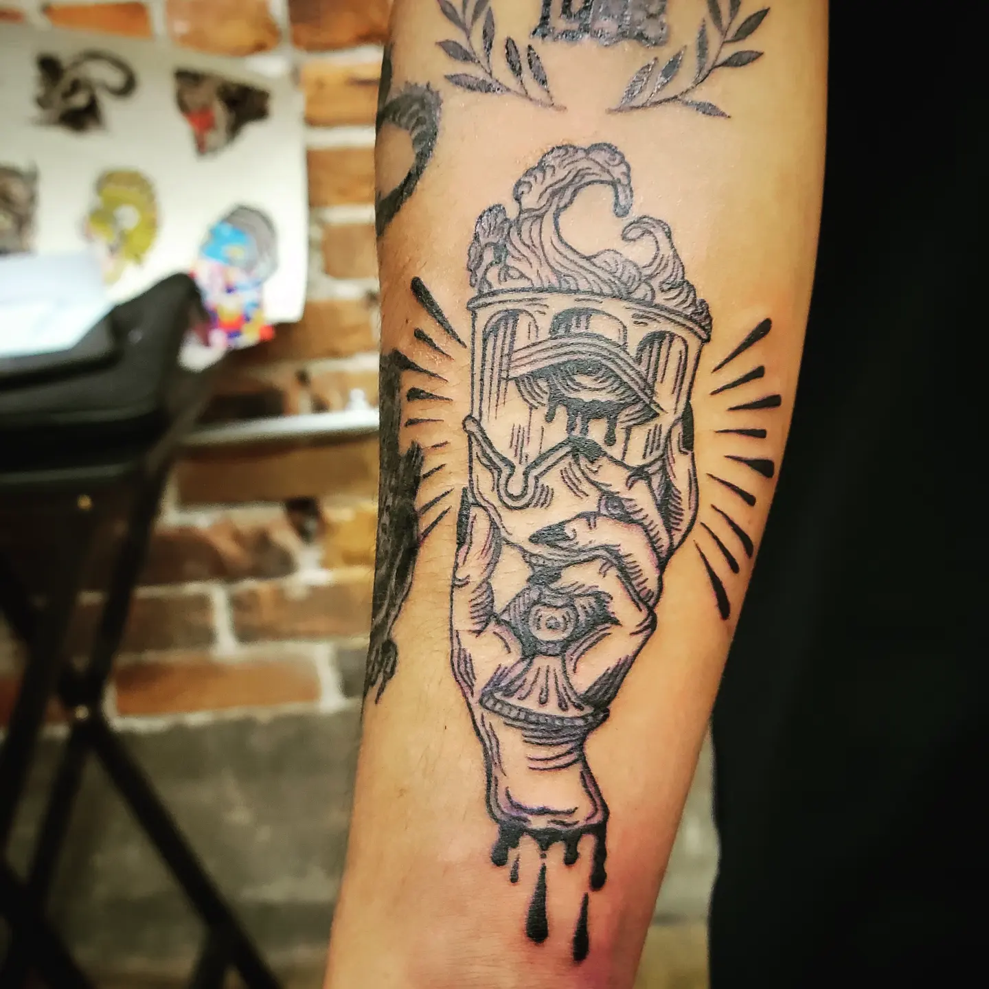 Eye and architectural structure black and grey tattoo on the forearm by Tim Andrews