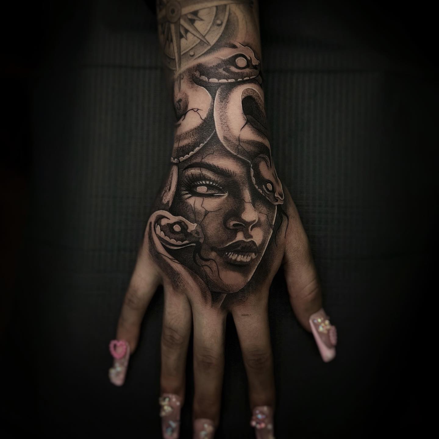Woman's face realism tattoo on the hand by 𝐓𝐚𝐭𝐭𝐨𝐨 👩🏻‍🎨