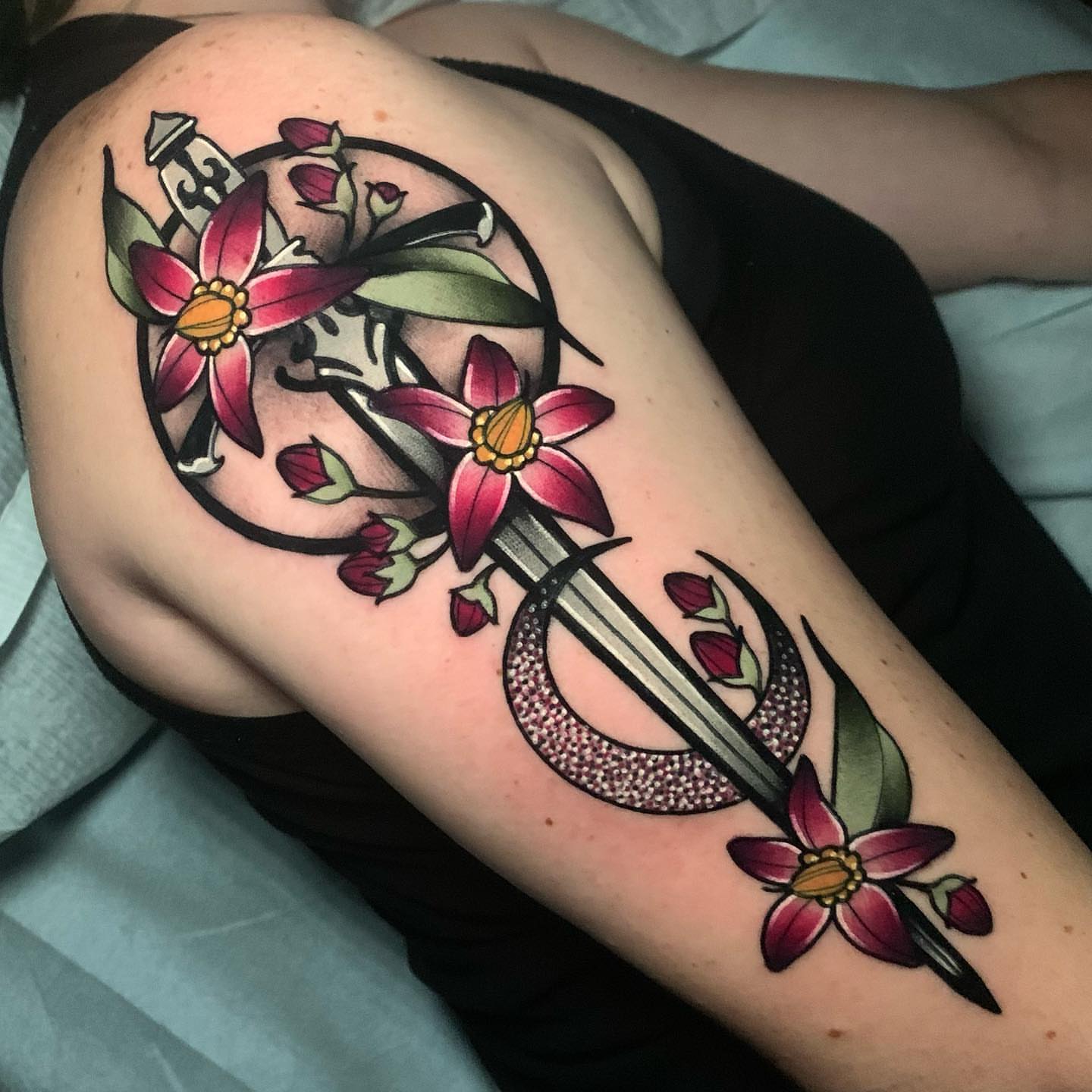 Flower and sword American traditional tattoo on the forearm by gillian marie