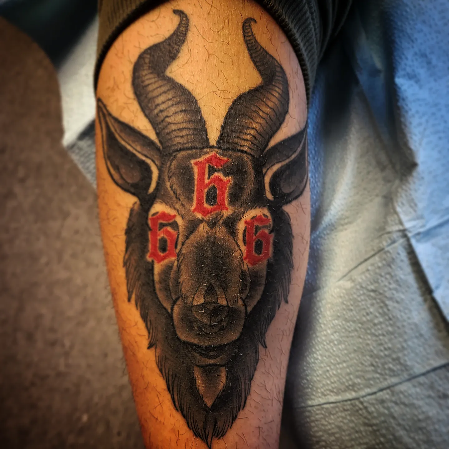 Goat head black and grey tattoo on the forearm by TattoosbyPhatboi