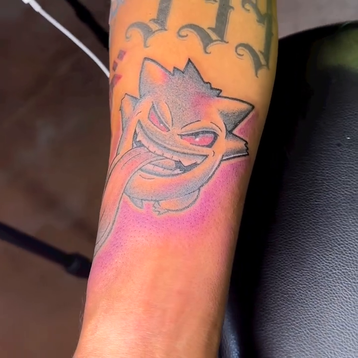 Gengar from Pokemon new school tattoo on the forearm by TC 🧚🏽, Columbus, OH