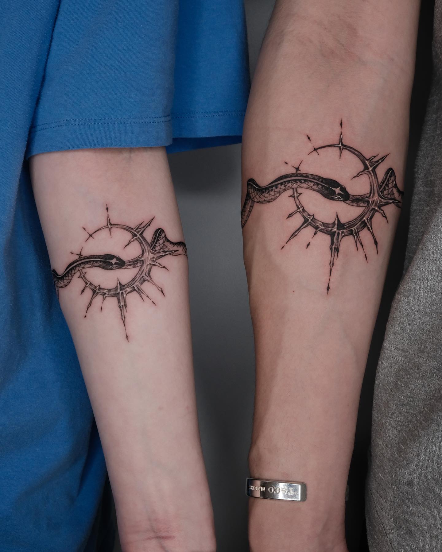 Snake and crown of thorns geometric tattoo on the forearm by Zay - Realistic tattoo Artist