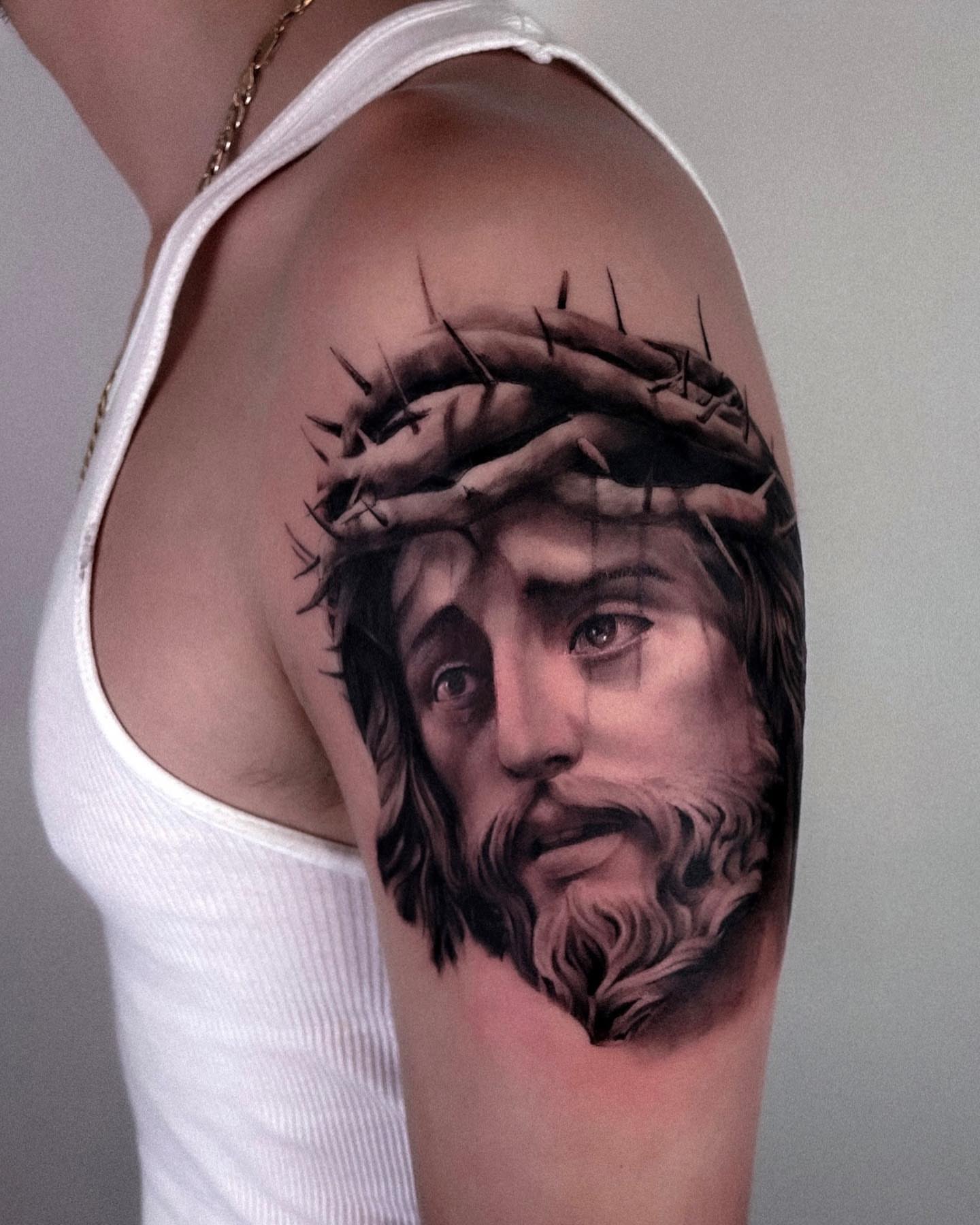 Jesus Christ realism tattoo on the shoulder by Aren