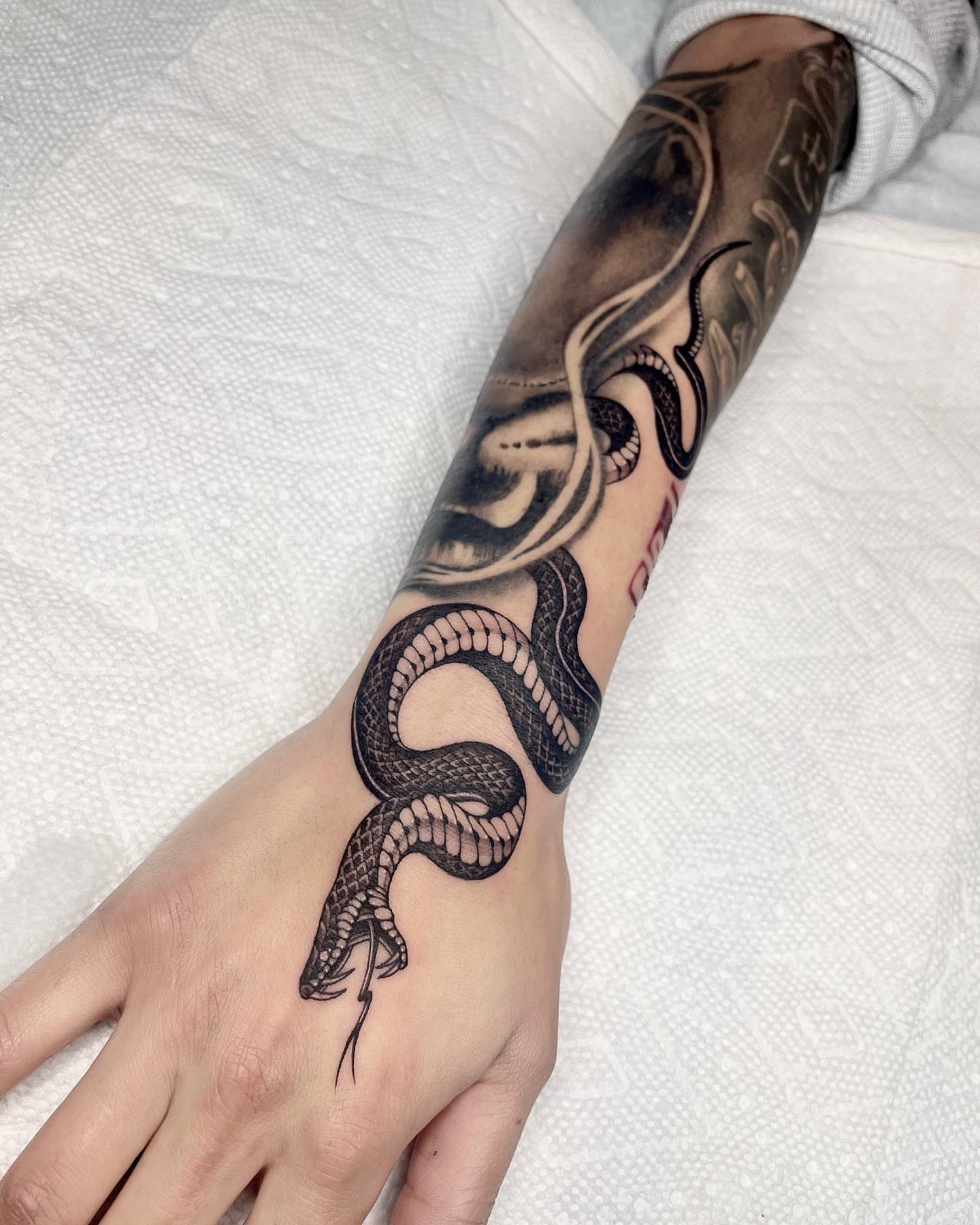 Snake realism tattoo on the forearm by LA tattoo