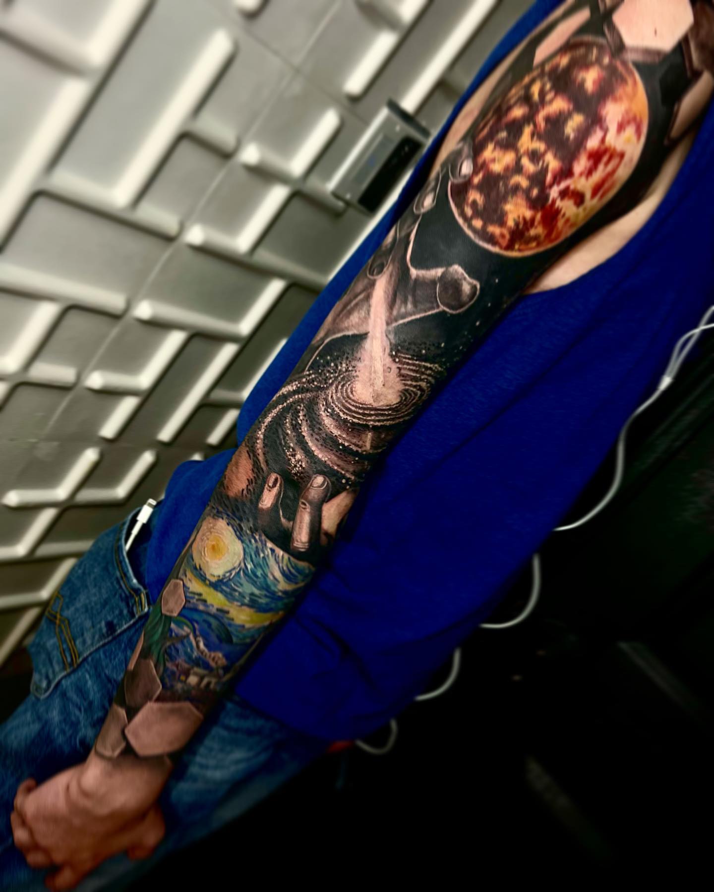 Galaxy and hands dotwork tattoo on the forearm by Vinny Holistic Ink
