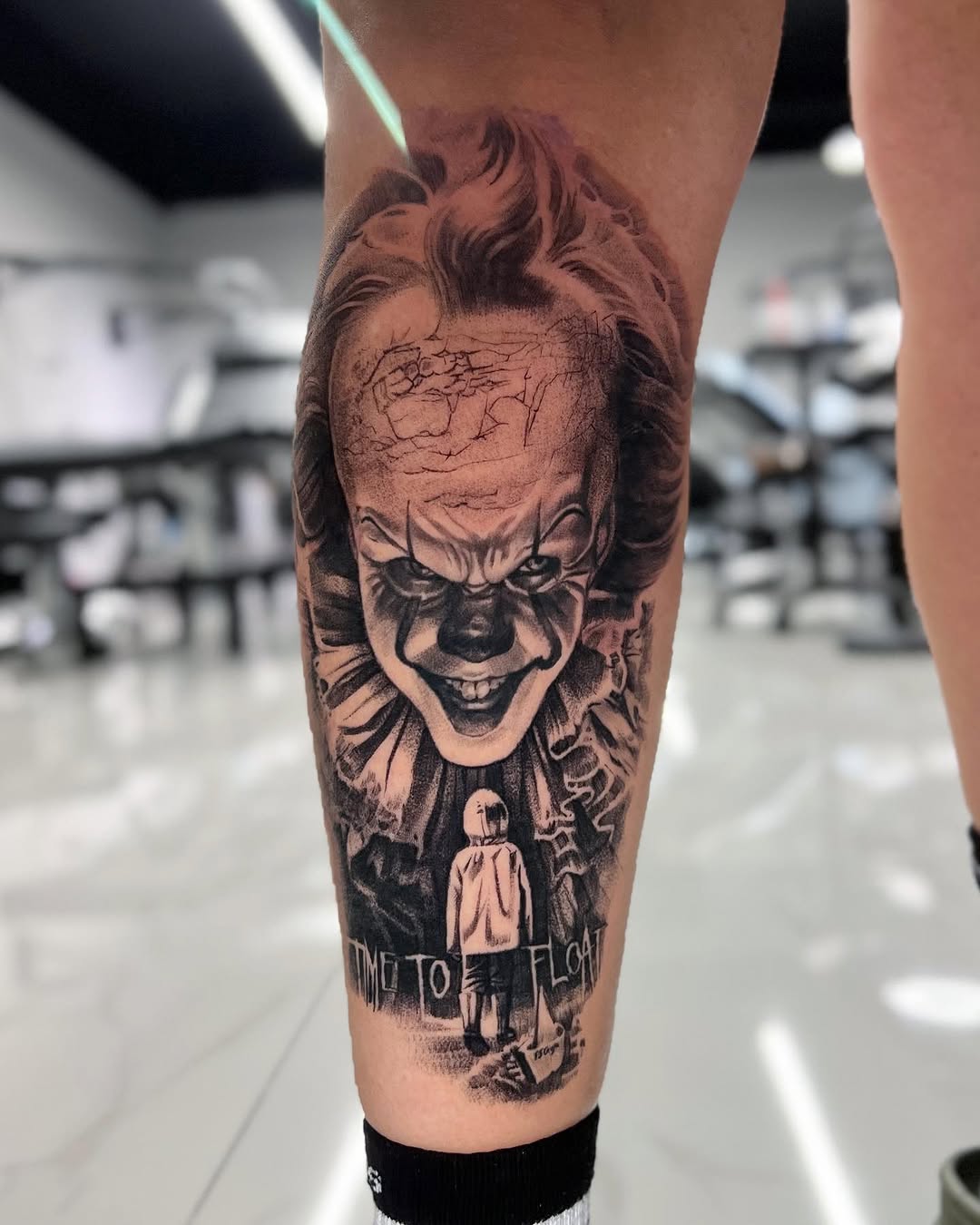 Pennywise the Clown and Georgie Denbrough realism tattoo on the forearm by Joey Hella Tattoo Artist