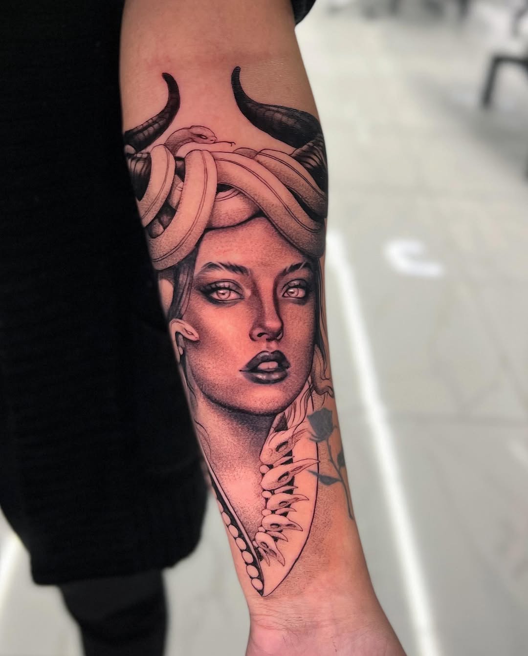Medusa portrait realism tattoo on the forearm by Joey Hella Tattoo Artist