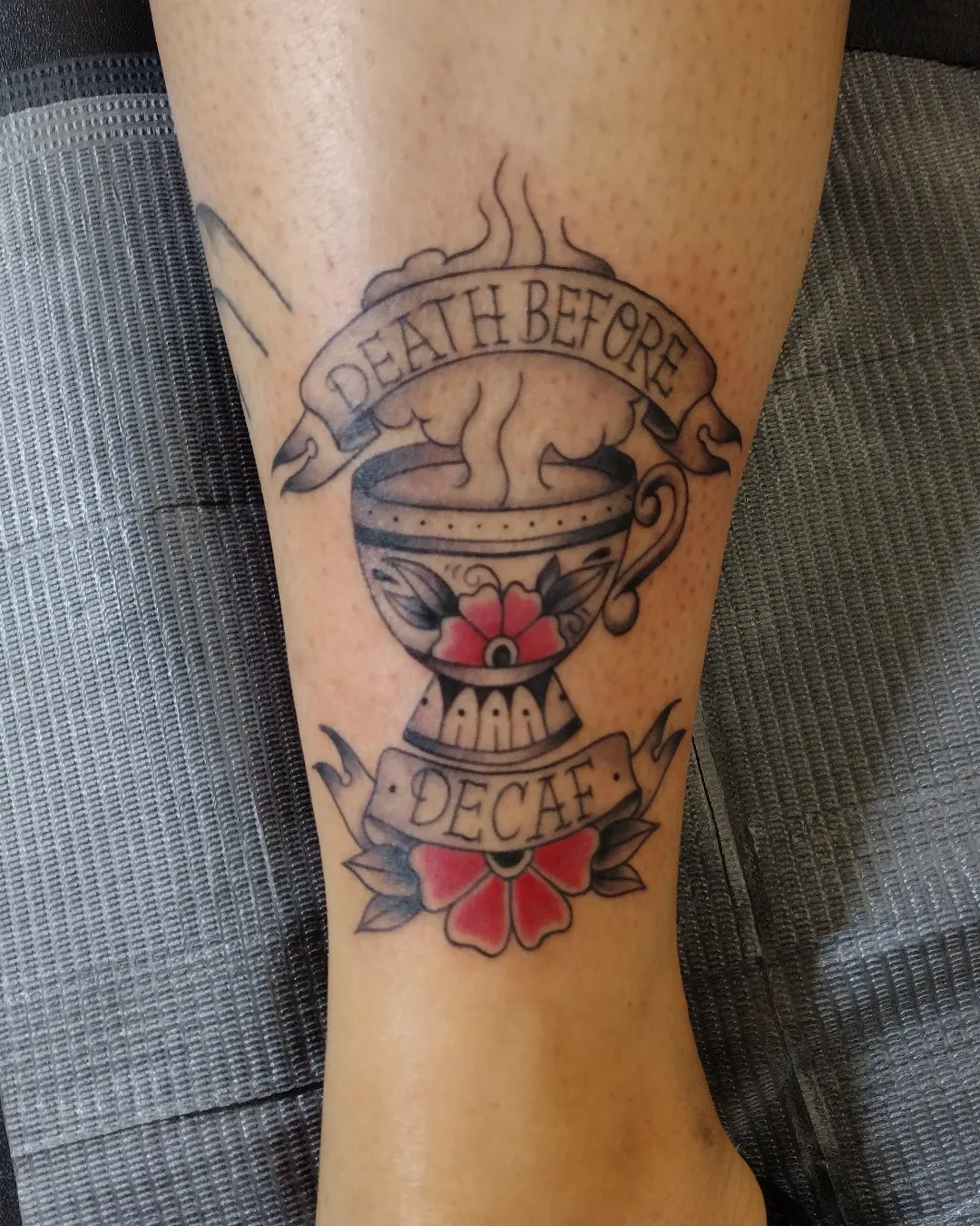Coffee cup and banner American traditional tattoo on the forearm by Herc
