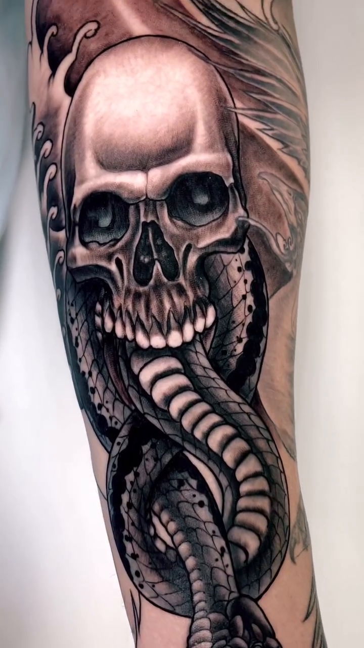 Skull and snake dark realism tattoo by Amaury Ramirez