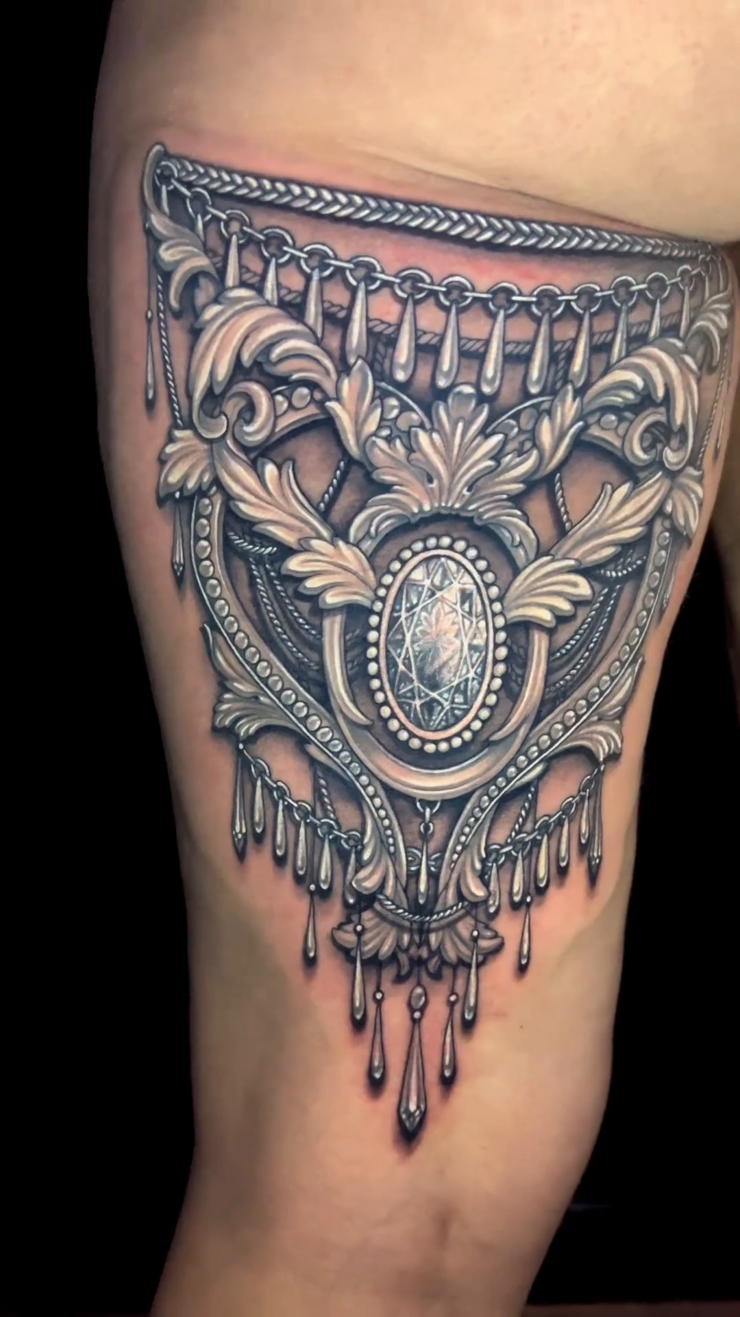 Ornate pendant with gem ornamental tattoo by Nikki Simpson