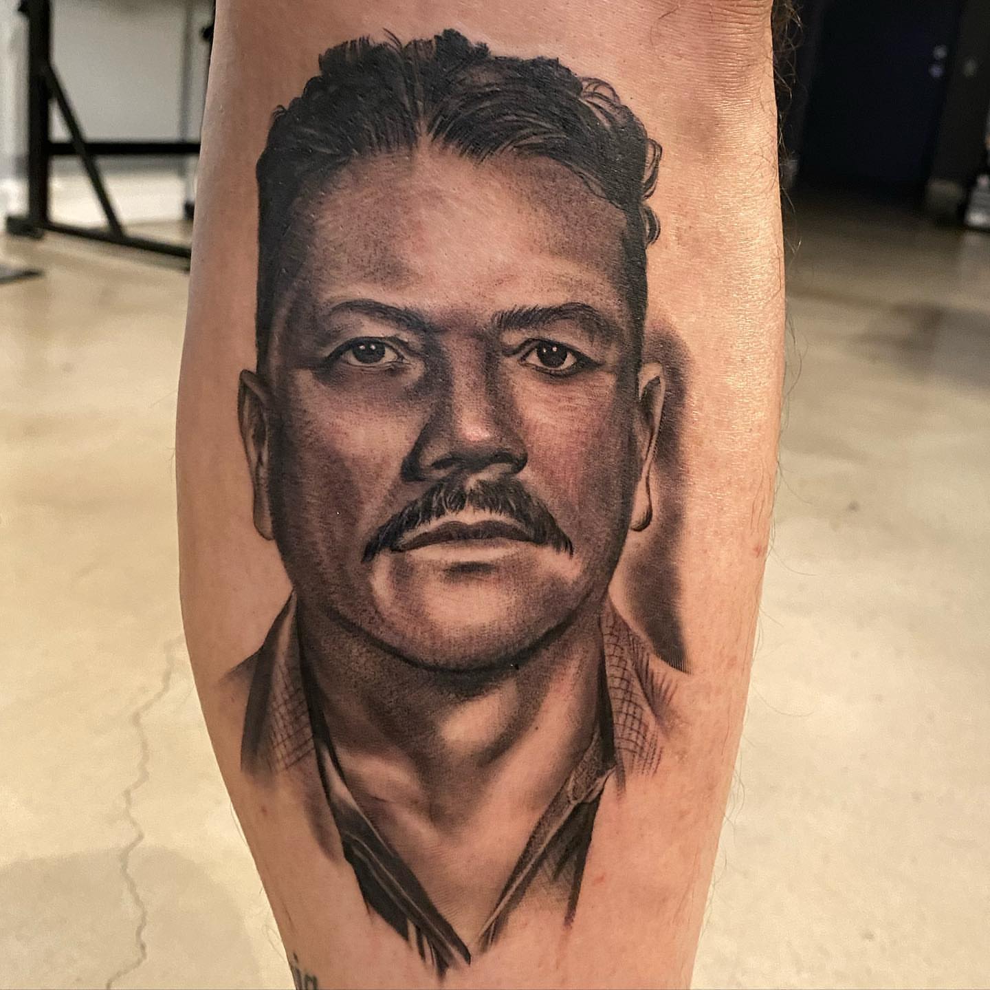 Portrait realism tattoo on the forearm by Living Life In The Gray Area
