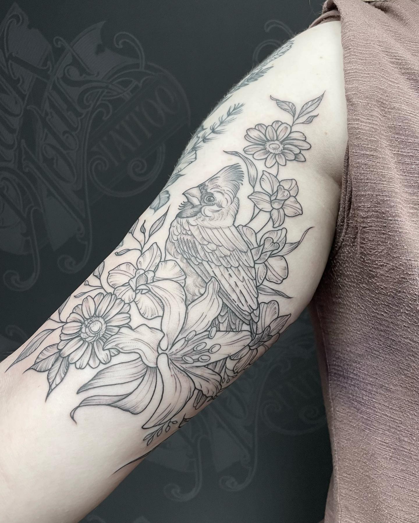 Bird and flowers black and grey tattoo on the forearm by Kirsten Marsden Ballantyne
