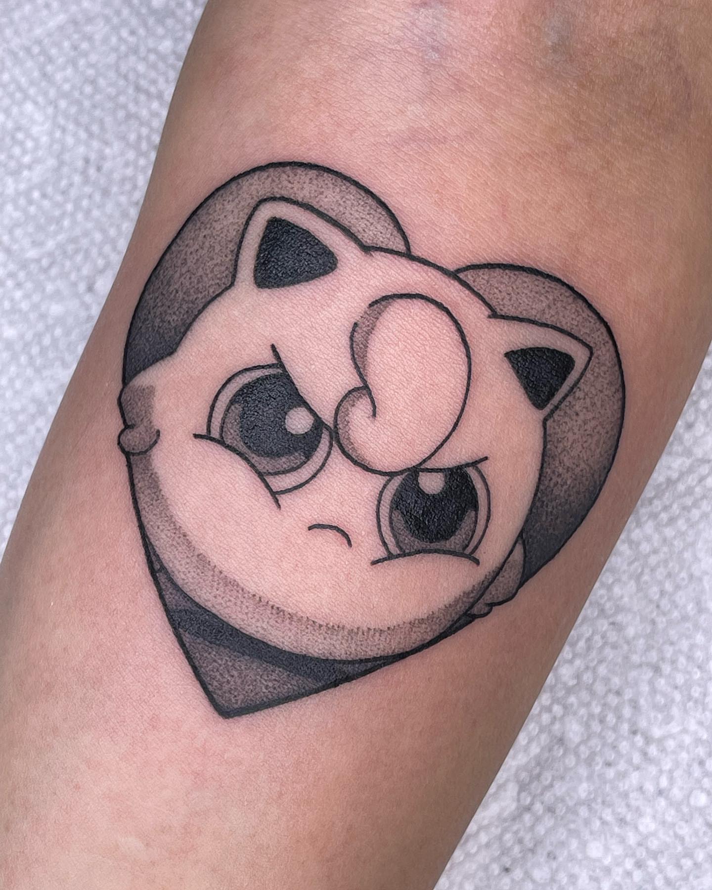 Jigglypuff black and grey tattoo on the forearm by Anastasia Vives