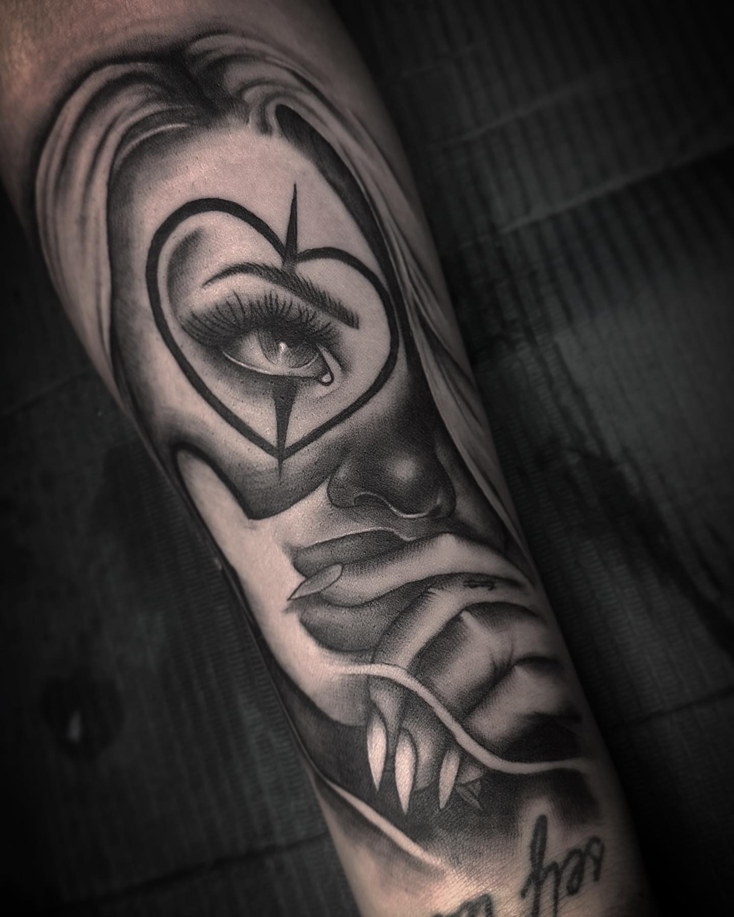 Eye with heart realism tattoo on the forearm by Rachel Martinez