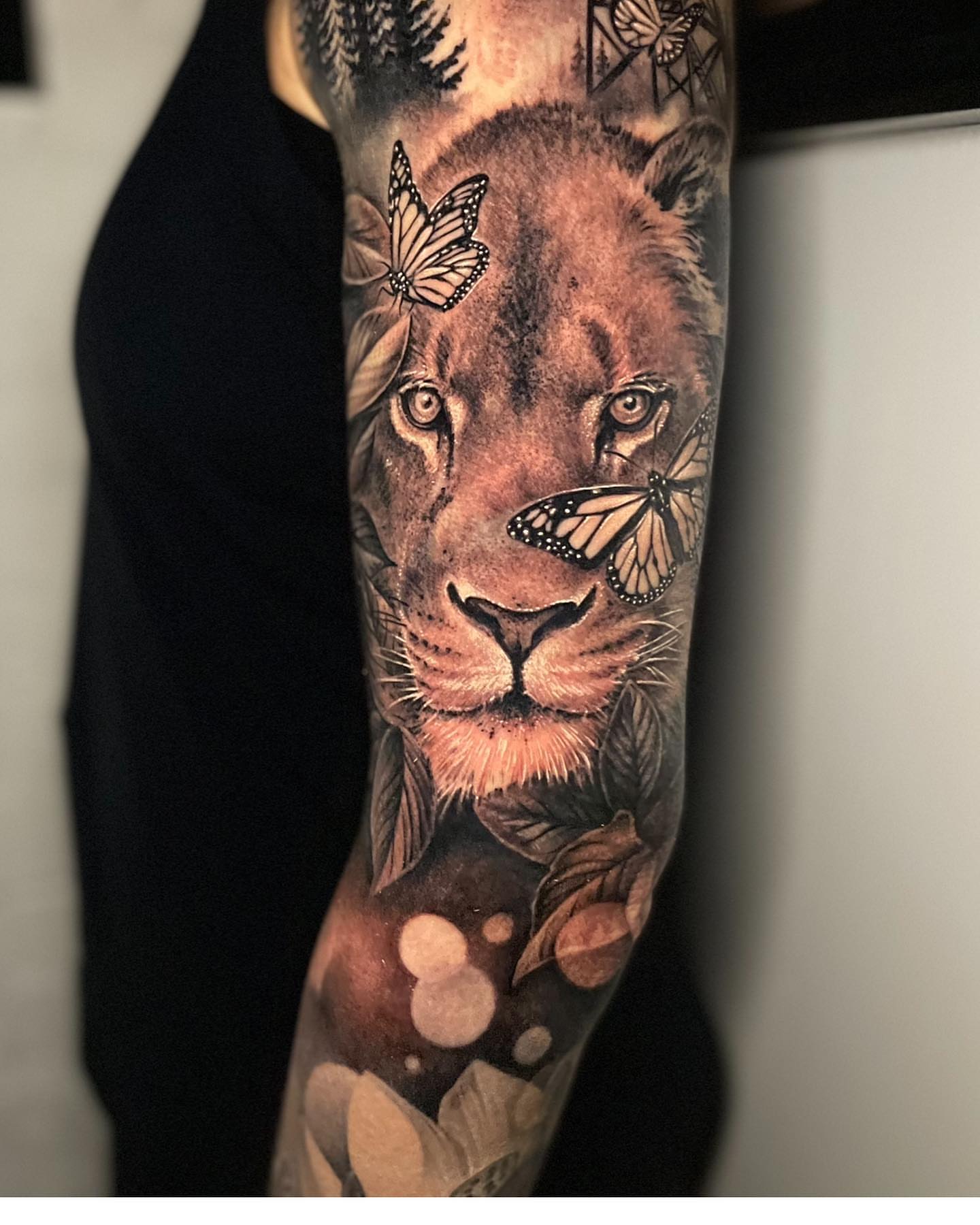 Lion realism tattoo on the forearm by Gabe Jensen