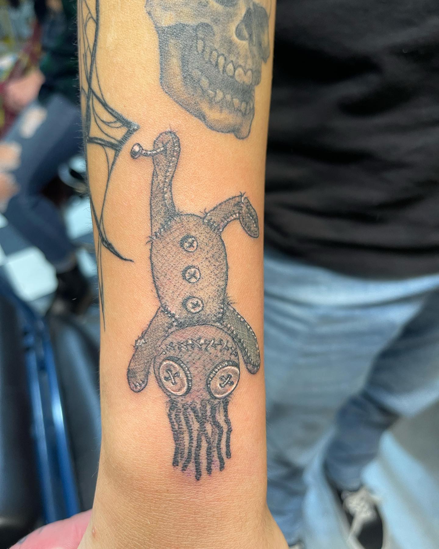 Voodoo doll dotwork tattoo on the forearm by Edward Choat