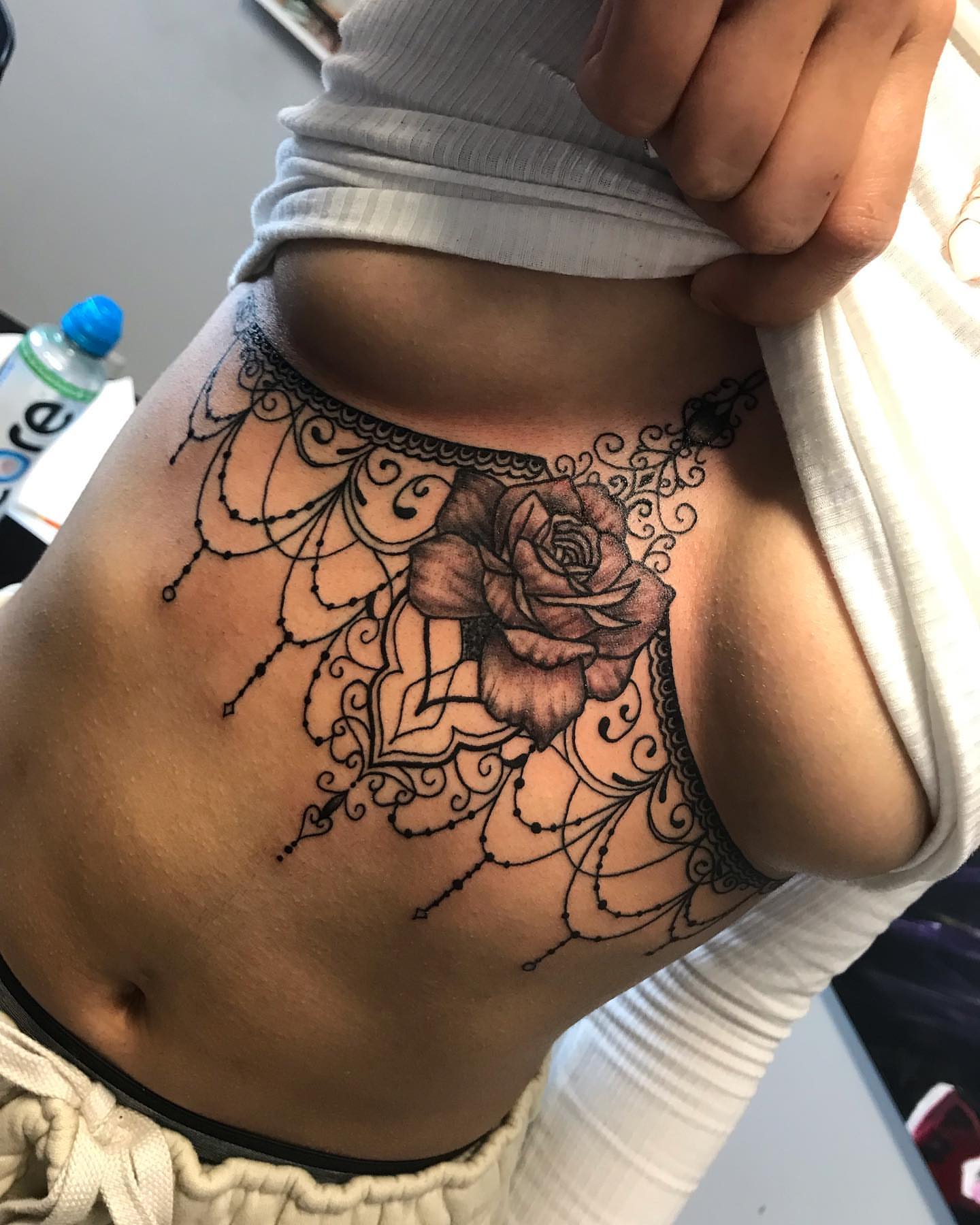 Rose black and grey tattoo on the thigh by Sk Pierce