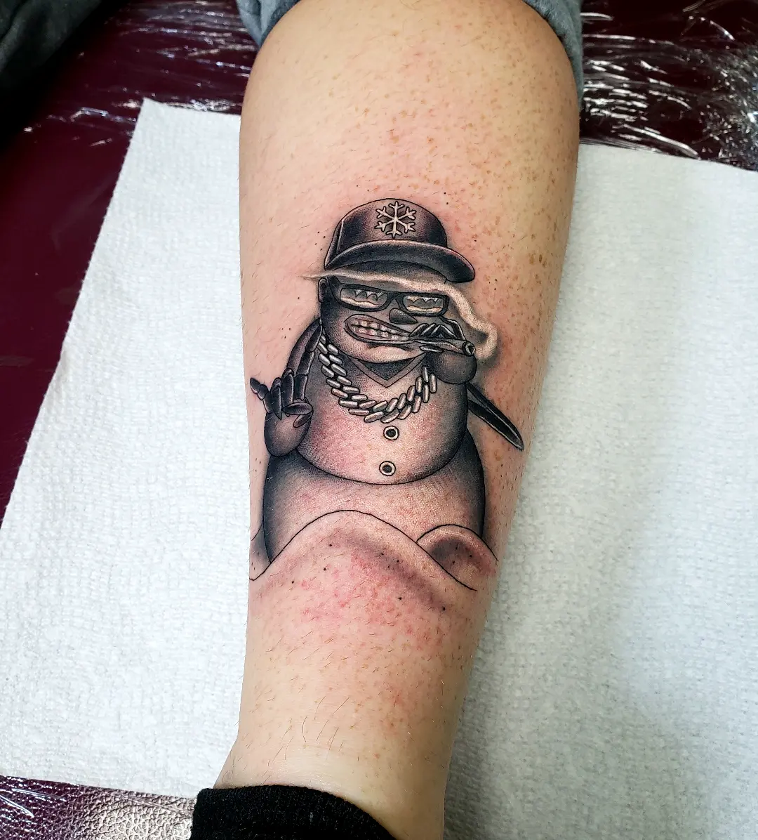 Snowman black and grey tattoo on the forearm by Jake Lee