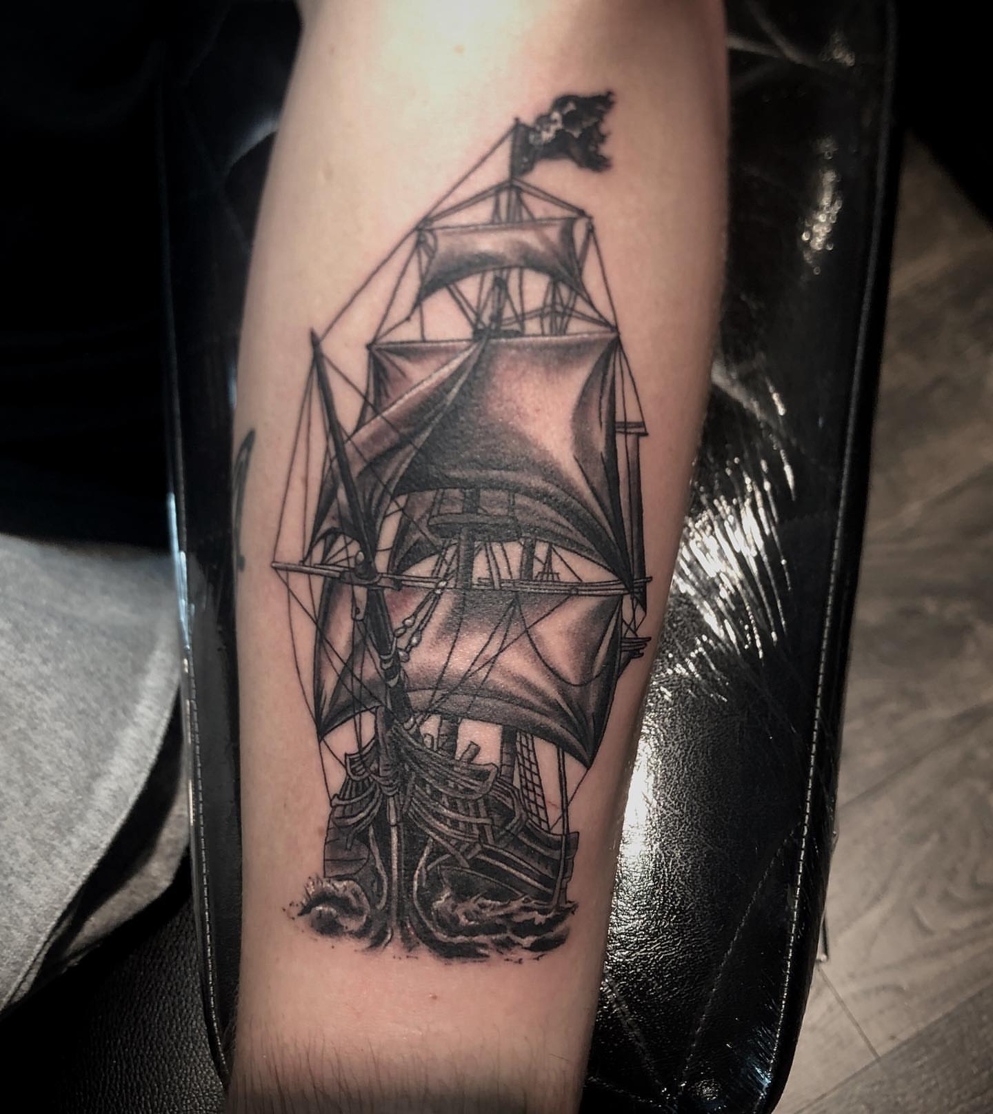 Ship realism tattoo on the forearm by alexandra