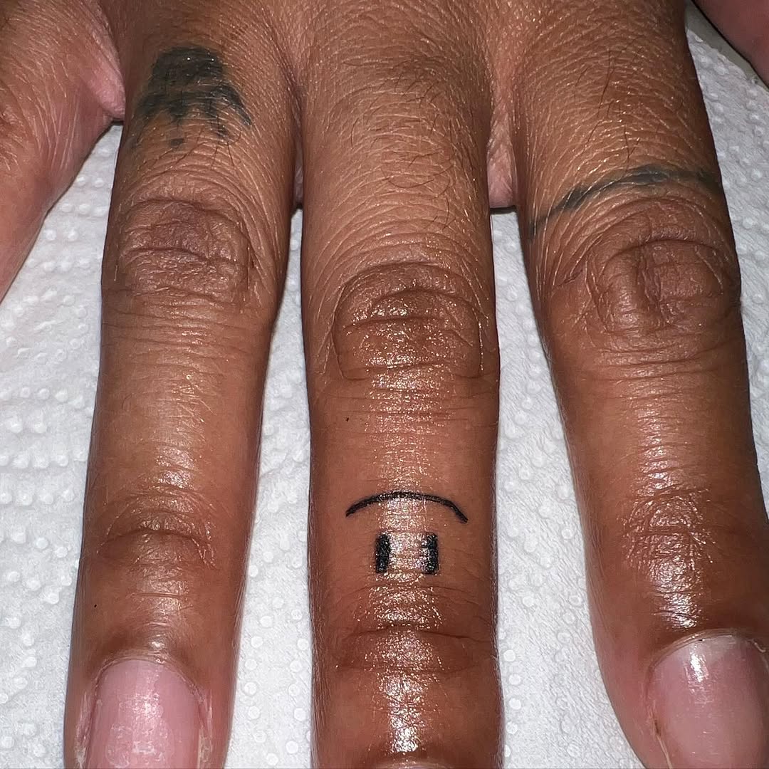 Smiley face minimalist tattoo on the hand by CmoreInk